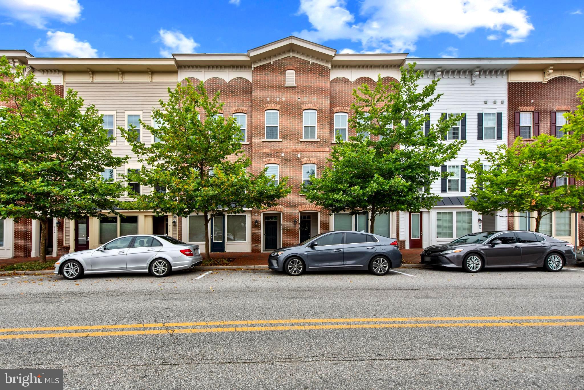 Experience Ultimate Flexibility with this Versatile and Spacious Contemporary Townhome offering Unique Zoning flexibility , 3 Finished levels with 3,016sf, and a Rare Live/Work Opportunity in Village Greens of Annapolis! Operate a boutique business, studio, or professional office right from your street-level commercial space with no commute - previously a boutique shop - with a convenient Kitchenette/Wet Bar area and Half Bath. Upstairs on the Main Living Level, discover an upscale, open-concept layout flooded with natural light and fabulous Designer Touches, Crown Molding, Plantation Shutters, Gorgeous Wood Floors and a Half Bath. The Beautiful Gourmet Kitchen features a large Island, Bright White Cabinets, Stainless Appliances and Quartz Counters in addition to the Spacious Dining area, and Inviting Living Room, Cozy Gas Fireplace and Deck create the perfect hub for Entertaining! Retreat to the Upper Level offering a Serene Primary Suite with Amazing Attached Bath and Walk-in Closet in addition to the 2 Spacious bedrooms, accompanied by another full bath and a den/flex space. This unit has been Meticulously maintained including a new AC unit (Oct 2025) and a freshly painted 2 Car Attached Garage featuring high-temp epoxy flooring and extra storage and plenty of parking.  Located just minutes from historic downtown Annapolis, major commuter routes, dining, and the waterfront. Live, work, and play without compromise! Schedule Your Showing Today!