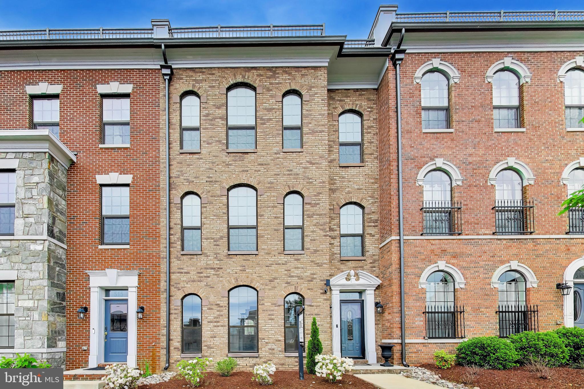 Welcome home to Potomac Overlook! Nestled in a vibrant gated waterfront community at National Harbor, this exceptional Adams Model townhome is the builder's widest floor plan at an impressive 24 feet - setting the stage for a home that brings modern elegance to every level. A striking brick exterior gives this residence the sophisticated character of a classic urban brownstone, while soaring 10-foot ceilings, crown molding, rich hardwood floors, and dramatic arched windows reaching nearly floor to ceiling flood every room with gorgeous natural light. Open and expansive, the main level centers around a spacious living room with a contemporary gas fireplace, flowing seamlessly into the chef's kitchen - a true showpiece featuring a classic tile backsplash, sleek granite countertops, and stainless steel appliances including a double wall oven and a top-of-the-line KitchenAid dishwasher. An oversized island bar flows into the generously sized dining room, perfect for everyday meals and effortless entertaining alike, while a private home office just off the kitchen features custom builder-installed cabinetry and granite countertops - a refined workspace that fits seamlessly into the home's elegant aesthetic. Upstairs, all bedrooms are spacious and well-appointed, beginning with a breathtaking primary suite that boasts a large walk-in closet and luxurious en suite bathroom complete with dual wide vanities, a freestanding soaking tub, and an oversized frameless glass shower. A second bedroom offers built-in shelving, a large closet with a custom closet system, and its own private en suite bathroom. Conveniently located on the bedroom level, the large laundry room features an extra-large Whirlpool washer and dryer. Up on the top level, incredible flexibility awaits - ideal as an in-law suite, private guest retreat, or bonus recreation room - alongside a full bathroom and a spectacular rooftop patio showcasing sweeping panoramic views of the Potomac River. Downstairs on the entry level, a bonus room serves perfectly as a home office or gym, with a fourth full bathroom making it an excellent guest space as well. Thoughtfully upgraded throughout with energy-efficient features including a dual-zone HVAC with Nest thermostats, a hybrid heat pump/water heater (2024), a mini-split heat pump in the garage (2024), a whole-home water filtration system, and solar panels (2024) that offset over 90% of electricity costs in 2025. Further highlights include a two-car garage with EV car charger and driveway offering easy secure parking and generous storage. Residents of Potomac Overlook enjoy a staffed security gate, HOA-maintained landscaping, nearby dog parks, and charming community gazebos - with additional private gate access during National Harbor events. Just minutes to the Potomac River waterfront, National Harbor's vibrant shops and dining - including popular destinations like Succotash and Grace's Mandarin - MGM National Harbor, Tanger Outlets, the Gaylord National Convention Center, TopGolf, the Capital Wheel, a movie theatre, and scenic biking trails, all while enjoying the calm of a quiet, private neighborhood. Quick access to I-95, I-495, and the Woodrow Wilson Bridge, plus a Metro Bus stop just a short distance away. Schedule a private tour of your gorgeous new home today!