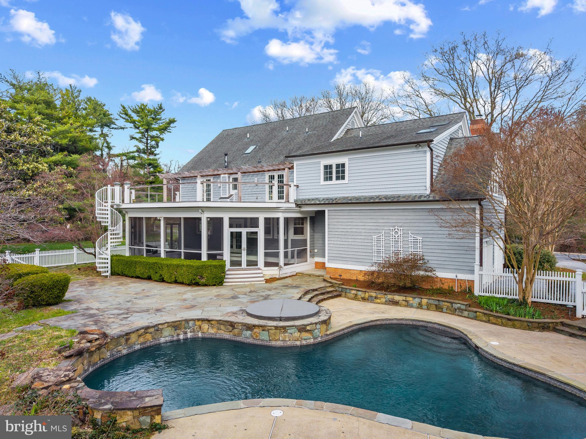 Set on a picturesque 1.51-acre corner lot in the sought-after community of Rugby Hall Estates, this classic colonial residence offers a rare blend of space, comfort, and a seamless connection to both indoor and outdoor living, highlighted by a private pool and an exceptional screened porch that invites effortless enjoyment of the surrounding landscape.

The expansive main level is designed for both everyday living and effortless entertaining, featuring formal living and dining rooms, a well-appointed kitchen with a casual dining area, and a welcoming family room anchored by a fireplace and dramatic two-story ceiling. A private office provides a quiet and functional workspace, while the overall layout is filled with natural light and a seamless flow between spaces.

Upstairs, the impressive primary suite offers a vaulted ceiling and a spacious, spa-like bath complete with a jetted tub, oversized shower, and generous walk-in closet. Three additional bedrooms are well-proportioned and share a thoughtfully designed hall bath, providing comfortable accommodations for family and guests. The expansive upper deck is  directly accessible by 2 bedrooms and overlooks the pool with stairs down to the backyard.

The lower level adds versatility with a bar area, built-in shelving, and a full bath, ideal for recreation or hosting, while the remaining unfinished space provides exceptional storage and future potential. Outdoor living is a highlight, with an enormous screened porch overlooking the beautifully landscaped yard, pool, and hot tub, creating a private setting for both relaxation and entertaining.

Residents enjoy easy access to the community marina just a few blocks away at the end of Buckingham Road, offering deep-water slips (approximately 8 ft MLW) on Ringgold Cove and convenient access to the Severn River. Ideally located within the Blue Ribbon Severna Park school district and just minutes to Annapolis, Severna Park, and the B&A Trail, this property presents a wonderful opportunity to enjoy a coveted lifestyle in one of the area’s most desirable neighborhoods. Welcome Home!