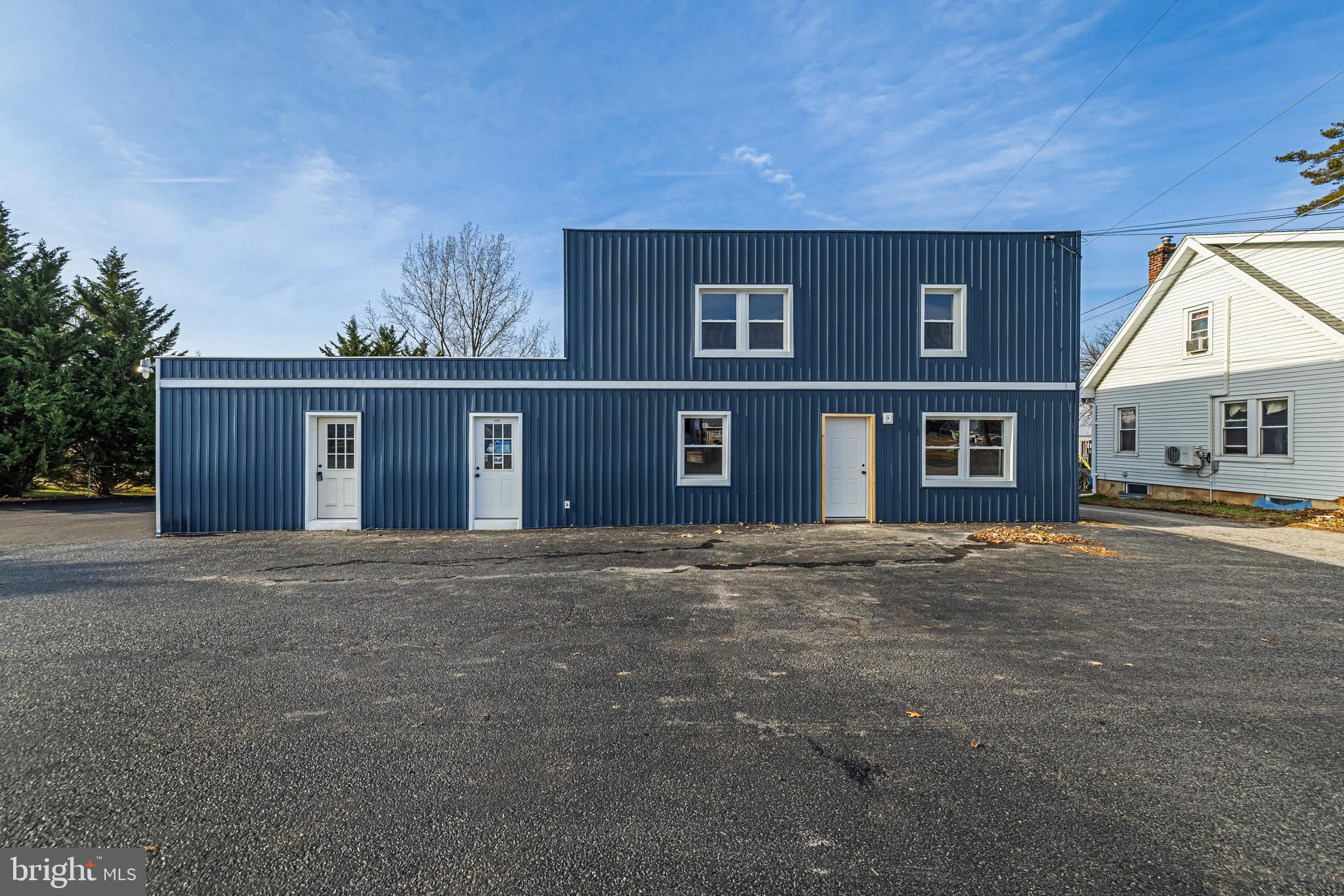 Welcome to 1480 Seven Valleys Rd, a mixed-use investment opportunity delivering in-place income with value-add potential. This property consists of a 4,042 square foot building configured into four units on a 0.69 acre parcel with over 20 paved parking spaces. Zoned commercial with a conforming use, the asset has been renovated in 2026 and is positioned for stabilized cash flow.

Two units are currently leased, including one operating under a multi-year NNN structure where the tenant contributes toward common area expenses, providing consistent income with reduced expense burden to ownership. The remaining two units are vacant, fully updated and turnkey, offering immediate lease-up opportunity with flexible pricing to align with current market demand.

Recent capital improvements include new exterior vinyl siding, newly paved parking lot, three updated kitchens, new flooring and paint throughout residential spaces, recessed lighting and updated water service infrastructure. The property also includes a two-post automotive lift and air compressor that convey with the sale.

Situated along PA-616 with strong visibility and approximately 9,000 vehicles per day, the location provides access to US Route 30, I-83, York, Hanover and the Maryland line within a 12 to 30 minute drive range.

The offering presents strong in-place income with additional upside through lease-up of the remaining units, creating an opportunity to increase net operating income through execution. Inquire for additional information to make this your next investment.