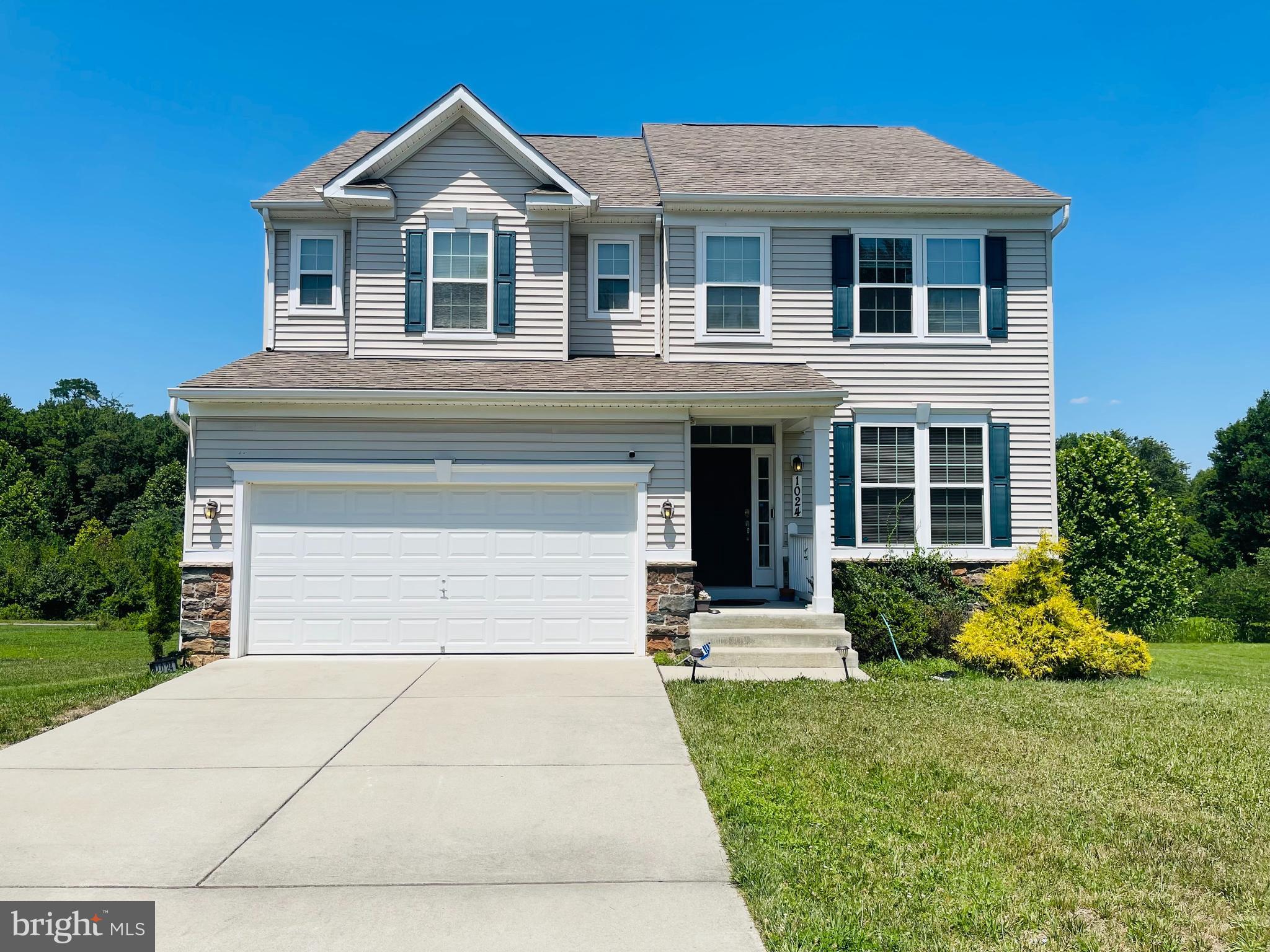 Welcome to Cloverly Forest, one of Silver Spring's most sought-after neighborhoods, known for its newer luxury homes, tree-lined streets, and convenient access to major commuter routes, parks, shopping, and dining. This impressive Richmond "Amy" model sits on a gorgeous half-an acre of lush green grass backing to peaceful tree views! The main level features brand new hardwood floors, high ceilings, dramatic two-story foyer, elegant formal living and dining rooms, and an expansive open-concept great room that flows seamlessly into the gourmet kitchen with a large center island! The breakfast room opens through glass doors to a a spacious deck perfect for grilling and gathering  surrounded by lush greenery, your perfect space to relax or entertain guests. The upper level features  a spacious  primary suite, an oversized walk-in closet, and a spa-like bath. Generously sized secondary bedrooms, abundant natural light, and thoughtfully designed living spaces make this home as functional as it is beautiful. The walk-out lower level features a large recreation room with doors leading to the gorgeous green backyard, a fifth bedroom and full bathroom.  Enjoy a private backyard and all the benefits of living in the highly desirable Cloverly Forest community, just minutes from the ICC, I-95 and downtown Silver Spring!