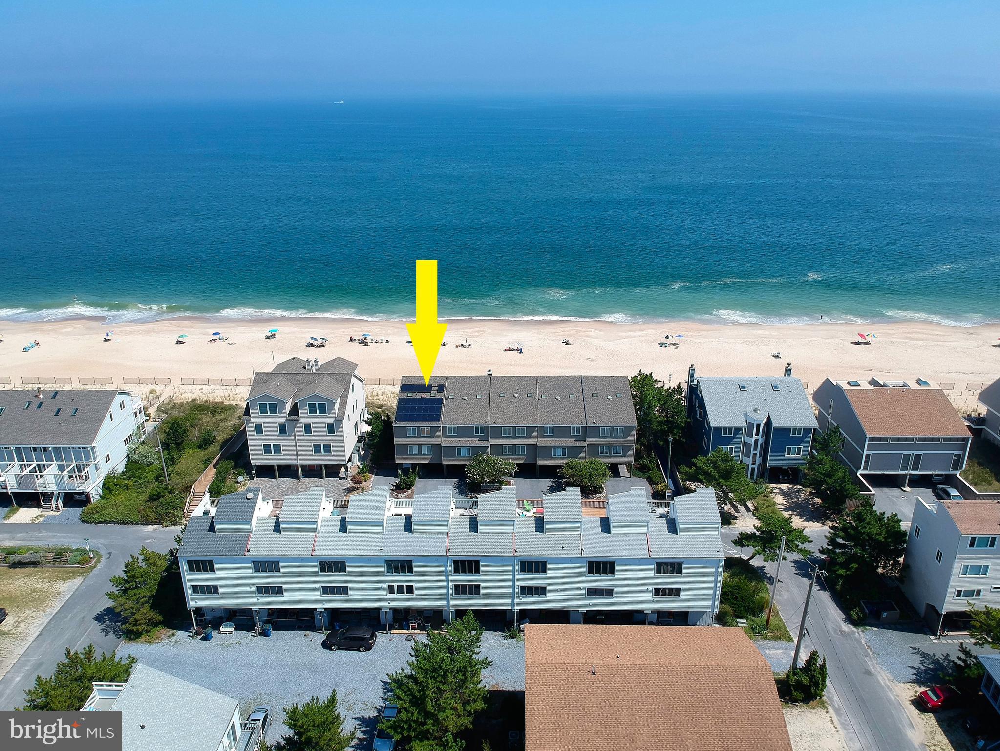 Step off your oceanfront deck directly onto one of the finest stretches of beach along the Delaware coast from this stunning Oceanfront end townhome with unparalleled views of the Atlantic from every level! This exceptional property has been meticulously maintained and completely updated with fine finishes and features throughout including a beautiful kitchen with sleek gray cabinetry, granite countertops, and a large center island with seating. Enjoy breathtaking sunrises over the Ocean from any of the 3 waterfront decks. An outdoor shower and secure storage room on the ground level make cleaning up after a day on the beach a breeze. Additional conveniences include solar panels that significantly reduce the cost of electricity, an electric vehicle charger in carport, and storm shutters for added protection and peace of mind while you are away. Offered fully furnished, this impressive home is ready to be enjoyed this summer. Positioned in the desirable Four Winds location of Tower Shores, this property’s direct beach access is a rare find!