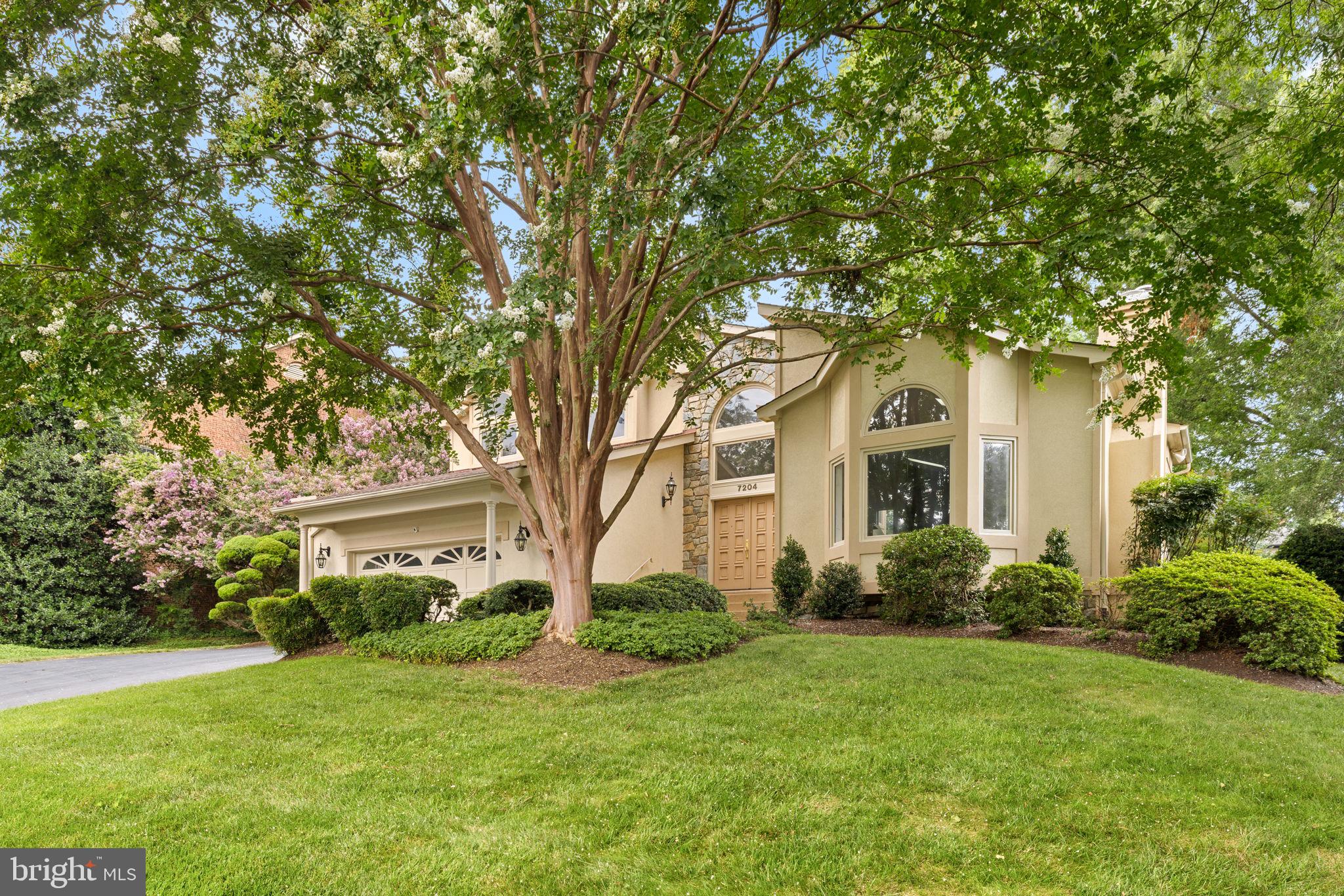 ***Interior photos coming!***
SELLER ACCEPTED OFFER
Tucked into one of McLean’s most coveted neighborhoods is a custom-designed residence offering approximately 4,700 square feet living space on a lush, beautifully landscaped lot. This contemporary home impresses with a dramatic open floor plan, soaring vaulted ceilings, and walls of oversized windows that bathe the interior in natural light, creating a warm, inviting ambiance throughout.

The main level welcomes you with a two-story foyer and a sunlit living room featuring cathedral ceilings with skylights and a gas fireplace. The adjacent dining room, framed by a large bay window, offers lovely garden views and is perfect for hosting formal gatherings. The expansive family room is equally dramatic with its vaulted ceilings, stone wood-burning fireplace, and seamless connection to the kitchen and breakfast nook—where another bay window overlooks the private, tree-filled backyard.

The spacious main-level primary suite provides a peaceful retreat with room for a sitting area, two walk-in closets, and an en suite bath with double vanities. A convenient powder room, laundry and mudroom, and access to the attached two-car garage complete the main floor.

Upstairs, an open hallway overlooks the living spaces below and leads to three generously sized bedrooms and two full bathrooms. The walk-out lower level features a large recreation room with a raised-hearth fireplace, a full bath, a cedar closet, and two substantial storage rooms—one of which could easily be converted into a fifth bedroom.

Outdoors, the fully fenced backyard is a serene, park-like haven. Mature trees, manicured planting beds, and expansive lawns frame a large flagstone patio—ideal for al fresco dining, entertaining, or simply relaxing in nature. A picturesque stone path winds through the garden, enhancing the home's peaceful, private setting.
