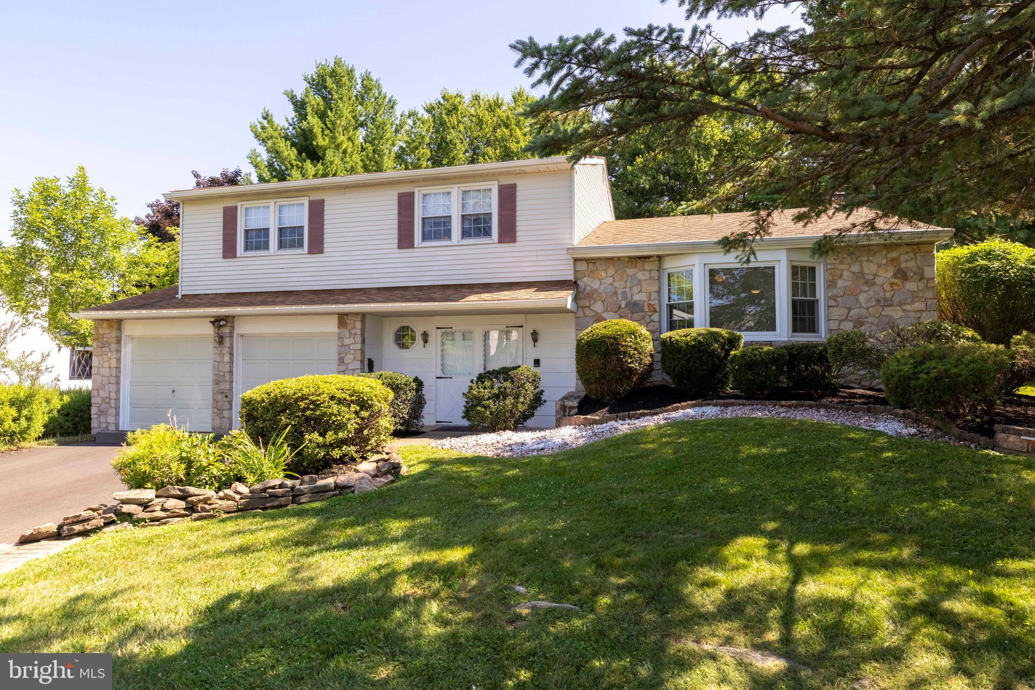 Welcome to this beautifully maintained 4-bedroom, 2.5-bath split-level home located in the highly sought-after Council Rock School District. Offering a spacious layout, tasteful updates, and an outstanding location, this home combines comfort, functionality, and style. Step inside to a welcoming foyer with ceramic tile flooring and a convenient first-floor powder room. The bright and inviting living room features a large triple window that fills the space with natural light, along with a ceiling fan for year-round comfort. The heart of the home is the stunning, recently renovated kitchen, thoughtfully expanded into the dining area to create an open and inviting gathering space. Highlights include granite countertops, a deep stainless steel sink, center island with breakfast bar, recessed lighting, and a large picture window overlooking the backyard. A beautiful stone-faced fireplace with a matching stone hearth adds warmth and character, making this space ideal for both everyday living and entertaining. The expansive great room offers endless possibilities for relaxing or hosting guests, featuring a ceiling fan, a second fireplace with a classic brick surround and tile hearth, and direct access to the covered rear patio—perfect for outdoor dining, entertaining, or simply enjoying the backyard. Upstairs, the spacious primary suite offers a peaceful retreat complete with a ceiling fan, dual his-and-her closets, and a private three-piece en-suite bath. Three additional generously sized bedrooms provide ample closet space and are served by a beautifully appointed center hall bath with tile flooring, tile-surround tub/shower, and vanity with storage. Additional features include a fully finished basement offering exceptional flexible living space, first-floor laundry, a newer water heater, and a two-car attached garage with remote openers and convenient inside access. Ideally located close to parks, shopping, dining, and major commuter routes, this exceptional home offers the perfect combination of space, updates, and location. Don't miss the opportunity to make this beautiful property your next home!
