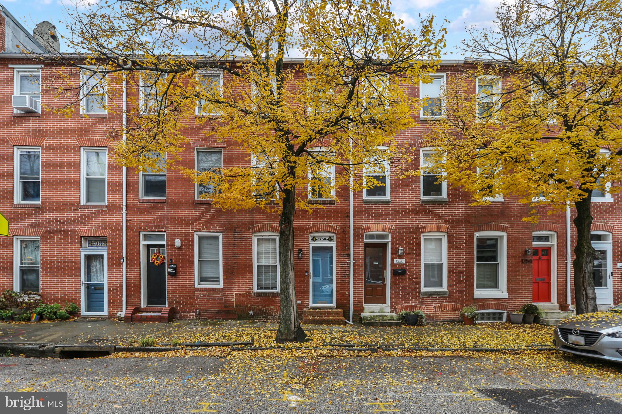 Spacious 3 bedroom, 3.5 bath home in Federal Hill with Parking Pad! This home features exposed brick, hardwood floors, chair rail, crown molding and recessed lighting. White shaker cabinets, granite counters, and stainless steel appliances found in the kitchen. Two bedrooms, two full baths and laundry on second floor. Third floor with bedroom and full bath.  The latest updates to this home include a new roof, new roof deck and tie backs for the brick that are ALL under warranty. Also see the new water pump for the basement.