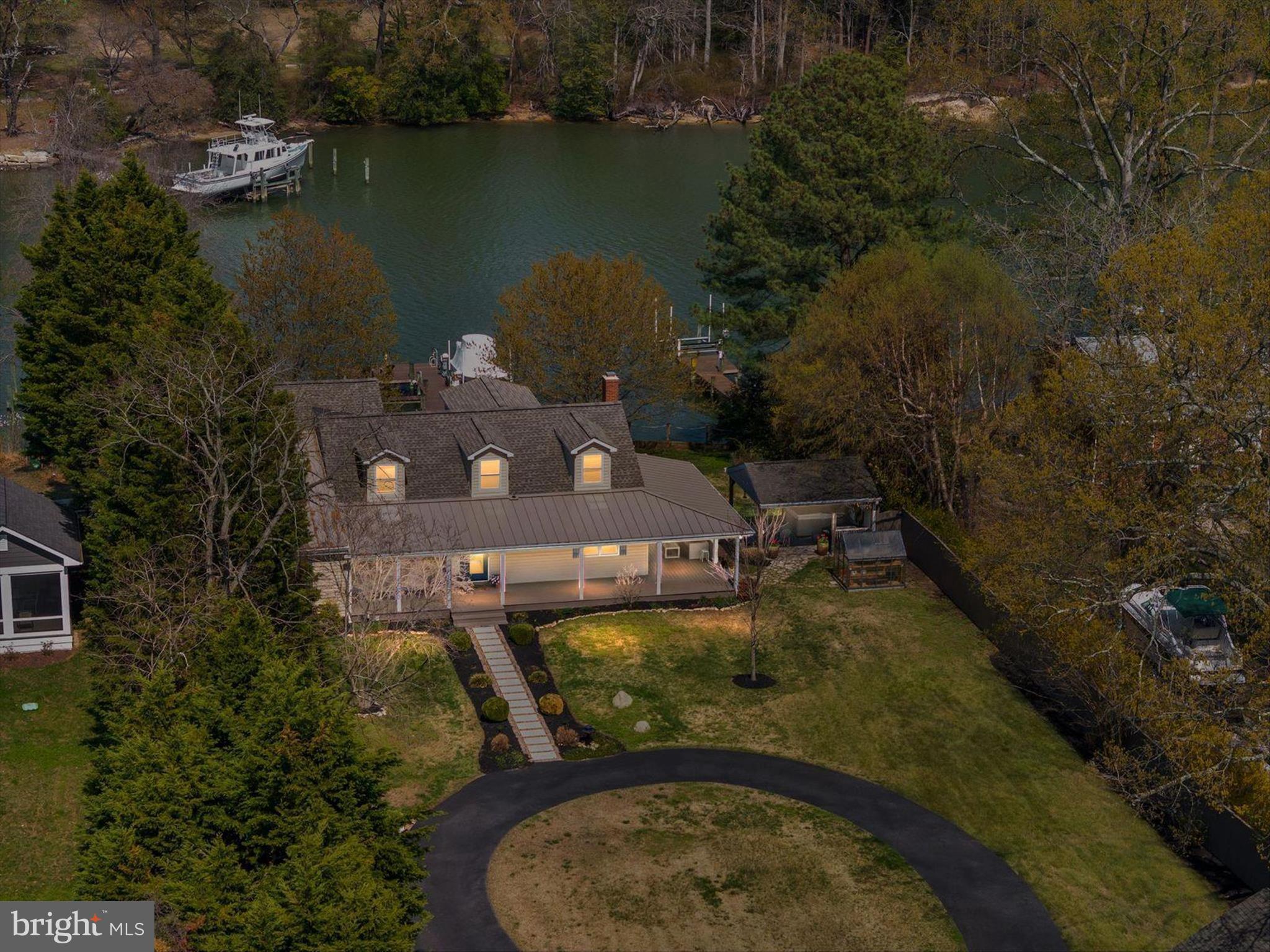 Welcome to 1862 Cedar Road — where waterfront living is done right.

Situated on 100 feet of deep-water frontage in a calm, deep water setting, this beautifully updated home offers 4 bedrooms and 3.5 bathrooms, including a first-level primary suite with heated floors and high-end finishes, plus a second main-level suite with private bath. Upstairs, two bedrooms feature spectacular water views.

The chef’s kitchen with upgraded appliances includes a prep island with additional sink and dual-zone wine refrigerator, flowing seamlessly into the dining area with a dedicated wet bar—perfect for entertaining.

A full stone, wood-burning fireplace (new stainless steel liner), hardwood floors throughout, and thoughtful updates add warmth and timeless appeal. 

Enjoy crabbing or fishing from your pier, quiet navigable waters, and stunning sunset views, all from the expansive wraparound porch.

Complete with a two-car garage and a convenient location near Pasadena and Annapolis, this home offers the perfect blend of comfort, quality, and waterfront lifestyle.