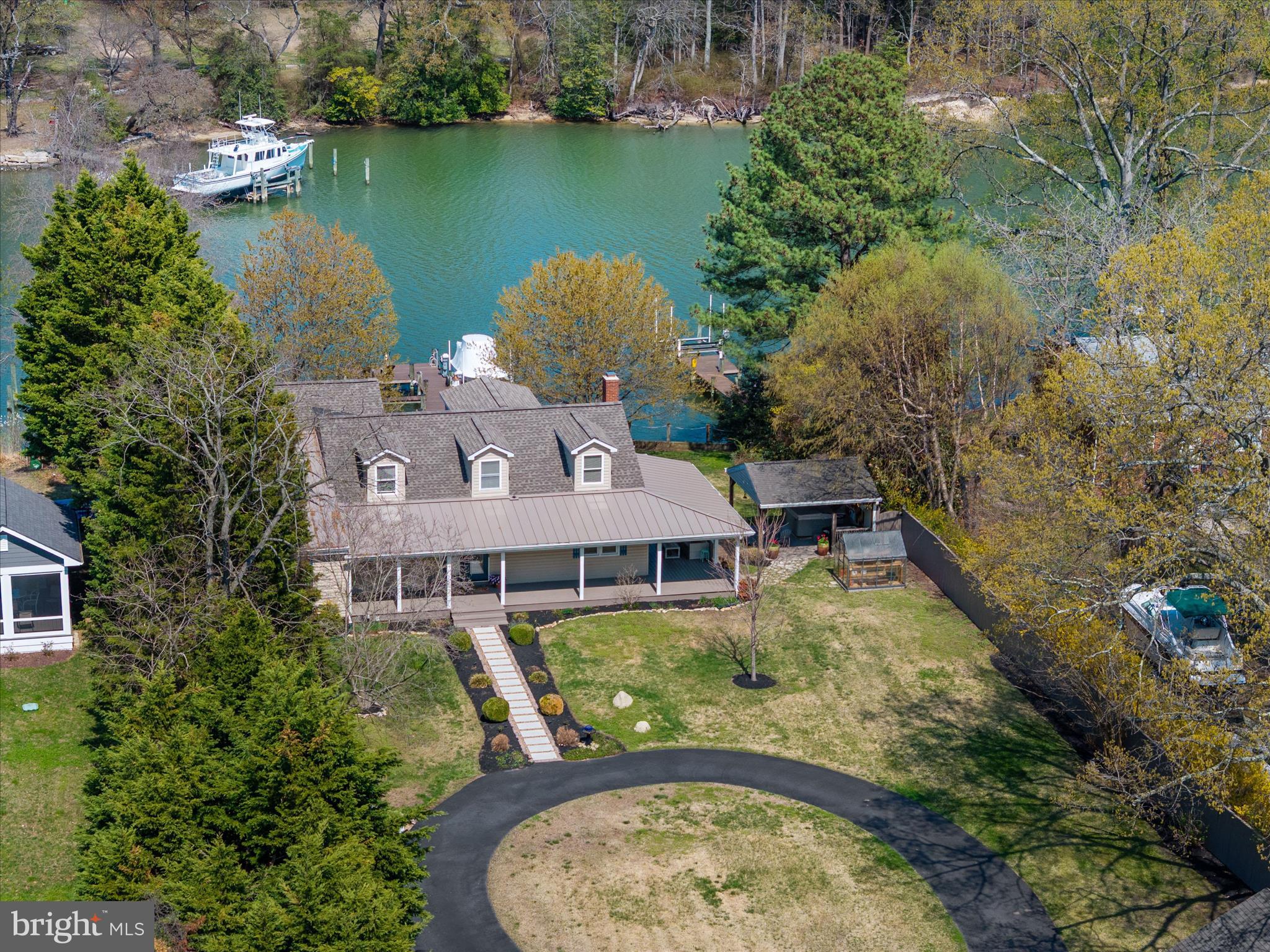 Welcome to 1862 Cedar Road — where waterfront living is done right.

Situated on 100 feet of deep-water frontage in a calm, deep water setting, this beautifully updated home offers 4 bedrooms and 3.5 bathrooms, including a first-level primary suite with heated floors and high-end finishes, plus a second main-level suite with private bath. Upstairs, two bedrooms feature spectacular water views.

The chef’s kitchen with upgraded appliances includes a prep island with additional sink and dual-zone wine refrigerator, flowing seamlessly into the dining area with a dedicated wet bar—perfect for entertaining.

A full stone, wood-burning fireplace (new stainless steel liner), hardwood floors throughout, and thoughtful updates add warmth and timeless appeal. 

Enjoy crabbing or fishing from your pier, quiet navigable waters, and stunning sunset views, all from the expansive wraparound porch.

Complete with a two-car garage and a convenient location near Pasadena and Annapolis, this home offers the perfect blend of comfort, quality, and waterfront lifestyle.
Owner financing available--call for details