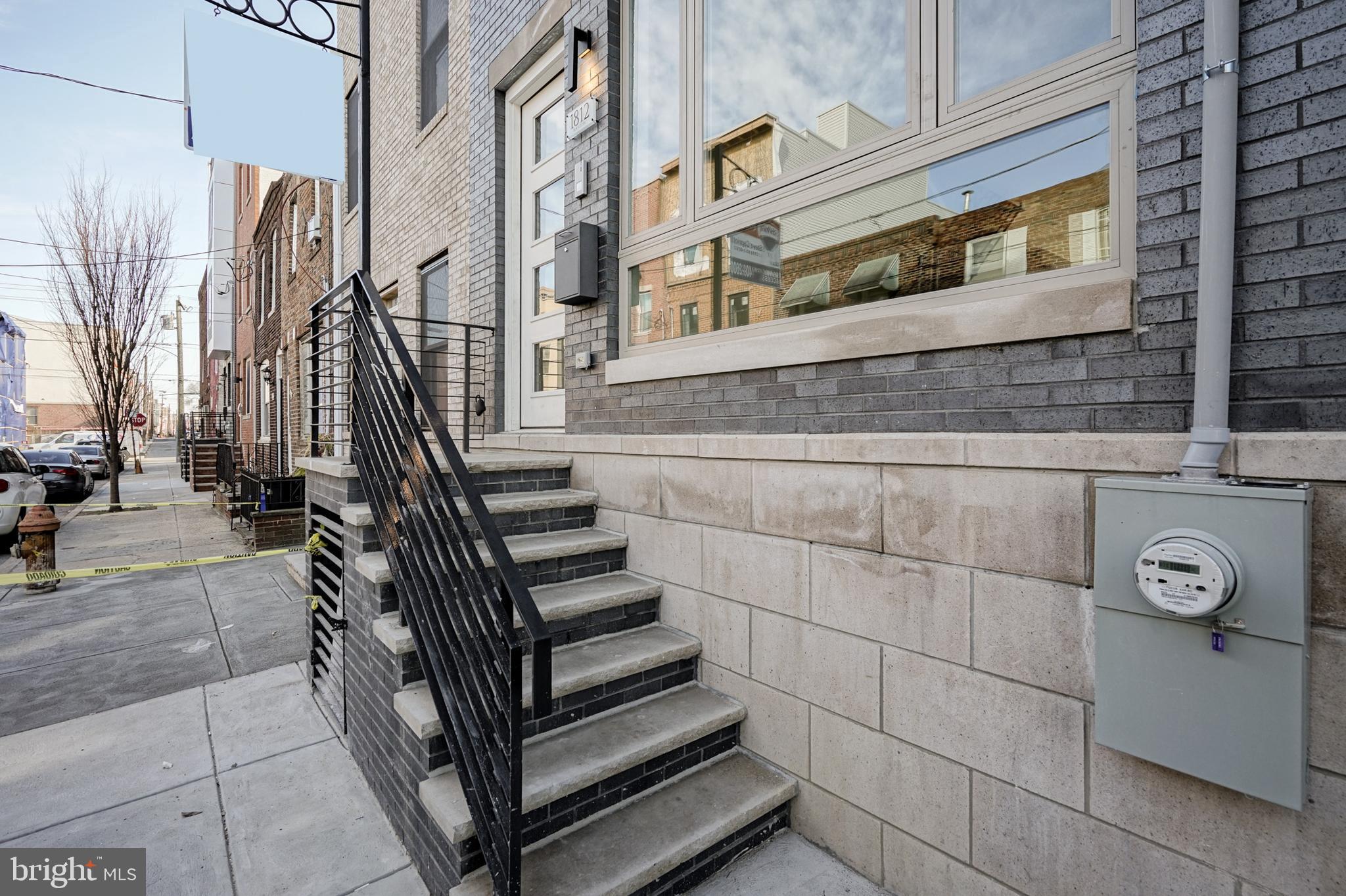 *OPEN HOUSE THIS SUNDAY 3/3 FROM 12-2PM*Spectacular New Construction in the Heart of Point Breeze!  First floor offers an open floor plan with custom lighted staircase, hardwood floors, and an amazing contemporary kitchen.  This kitchen has it all!  Beautiful quartz counters, floor to ceiling cabinets, slide in range with overhead exhaust, and under counter microwave.  Second floor features two spacious bedrooms with frosted glass doors, laundry room, and modern ceramic hall bath with tub.  Third floor has a stunning master bath with marble floor, over sized shower, and double vanity. Hall to master bedroom offers a powder room and wet bar which is convenient when entertaining on roofdeck.  Large master bedroom has tons of natural light and Juliet balcony.   Full finished basement with full bath.  Custom rails throughout, voice/video intercom system, and wired for bluetooth speakers.  Easy to show!  Check out the virtual tour!