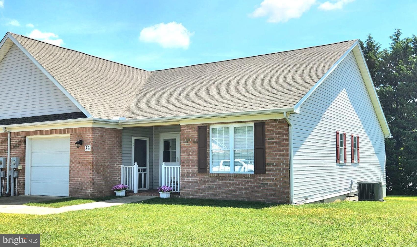 Well maintained, one level Villa in Tuscawilla Hills S/D.  Relax on your front porch or enjoy your back deck. Just minutes away from Locust Hill Golf Course and the Handy Mart.  This home features 2 bedrooms/2 full baths, country kitchen with sitting area, living room, dining room, mudroom and laundry room. One car garage.  Brick front. New roof in 2022,  wood flooring in living room, dining room and bedrooms.