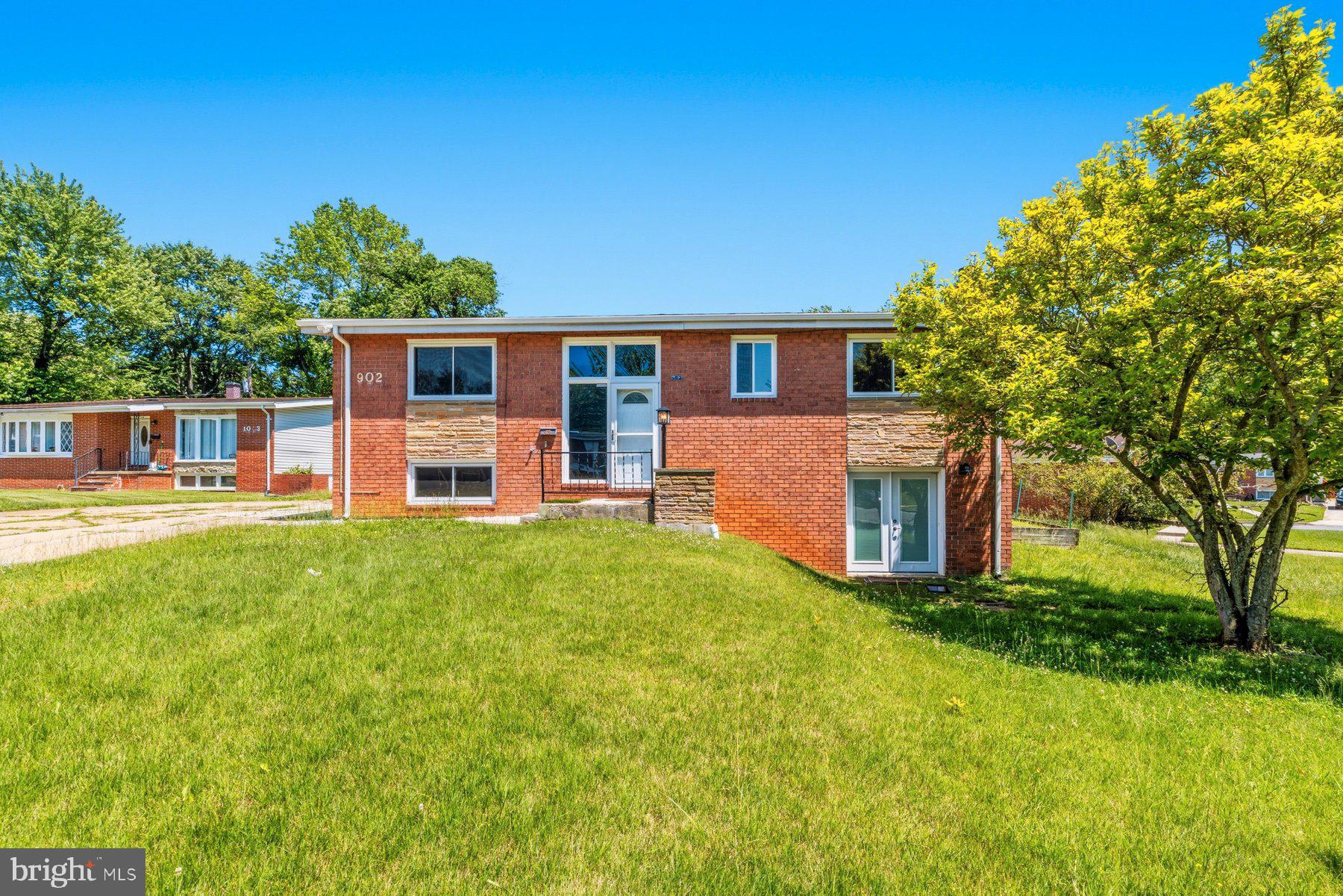 Exquisitely maintained and move-in ready 4BR/3BA split foyer home located on a spacious corner lot in the quiet neighborhood of Scotts Hill. Recently refreshed with thoughtful updates, this home is looking better than ever, and the updated photos beautifully showcase its enhanced appeal. Make your way to the front door and step inside a home filled with glamorous designs throughout each room. From the entry, take the stairs leading up to the main floor living space, which boasts stunning luxury flooring, gorgeous lighting fixtures, a soft color palette, vaulted ceilings, and a custom feature wall.

The main living area offers a large living room, spacious dining room, and gorgeous kitchen. The kitchen features plenty of wood cabinetry finished with crown molding, a pantry cabinet, stainless steel appliances including a slide-in gas range, stunning natural stone countertops and sink, a large window allowing for tons of natural light, and just outside the kitchen, a custom wine rack/closet.

Down the hall are two sizable secondary bedrooms, a full bath, and a primary bedroom with a private ensuite boasting a walk-in shower. The glamour continues onto the lower level, offering a large primary bedroom, a spacious closet room with custom shelving and dressers, a full bath with a walk-in shower, a spacious family room with a wood-burning fireplace, and not one but two dry bars—one with a wine fridge and the other with a beverage fridge. French doors lead to a cozy front patio, creating the perfect spot to unwind.

From the main floor, step outside to a spacious fenced yard featuring a covered patio, mature trees, and endless possibilities for entertaining or relaxation.

As an added bonus, buyers who use the seller's preferred lender may qualify for up to $15,400 in closing cost and/or down payment assistance. First-time homebuyer status is not required to take advantage of this opportunity.

This stunning home is truly move-in ready and conveniently located near shopping, restaurants, and commuter routes.