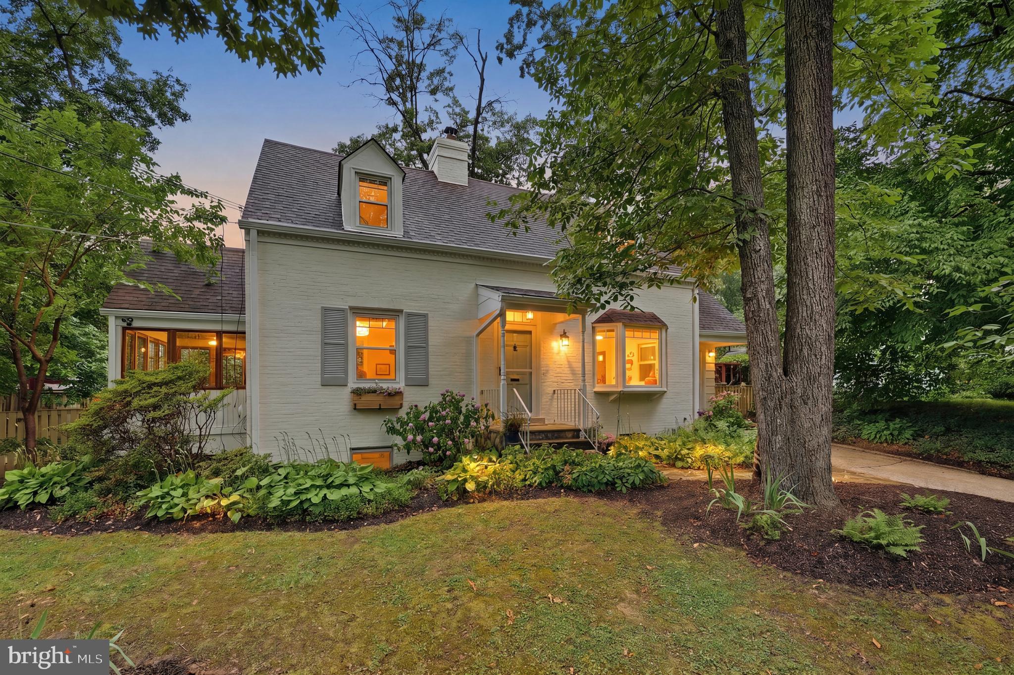 Nestled beneath a canopy of mature trees in sought-after Highland View, this expanded Cape Cod offers the perfect blend of character, comfort, sustainability, and convenience. With 4 bedrooms, 2 full baths, 1 half bath, and more than 2,000 finished square feet on three finished levels, this is a home that lives far larger than its footprint suggests.

Inside, you'll find gracious room sizes, beautiful hardwood floors, abundant natural light, and thoughtful architectural details throughout. The inviting living room is anchored by a stunning fireplace with a modern mantel, custom built-ins, and a catalytic double-burn feature that delivers warmth long after a traditional fire has faded. The home's generous proportions continue upstairs, where a wide upper-level hall, ample closet space, and spacious bedrooms provide the comfort and storage often missing from traditional Cape Cod homes.

The updated kitchen with island flows seamlessly into the home's living spaces and circular floor plan, creating a natural gathering place for everyday living and entertaining. The finished walkout lower level offers exceptional flexibility with a fourth bedroom, full bath, recreation room, guest suite, home office, or fitness area. Custom built-ins, cleverly concealed storage solutions, and versatile spaces add both character and functionality, allowing the home to adapt beautifully to changing needs over time.

The true magic of this home is found outdoors. Designed to celebrate the seasons, the property features mature shade trees, native plantings, and thoughtfully curated gardens that bloom from spring through summer. The fully fenced backyard offers a wonderful balance of sun and shade, creating comfortable outdoor spaces throughout the day. Fruit-bearing blackberry, black raspberry, and mulberry plantings add charm and seasonal harvests. The screened porch overlooks the lush backyard, while the expansive flagstone patio provides the perfect setting for entertaining, dining al fresco, or simply enjoying the peaceful surroundings. Designed with permeable materials, the patio allows rainwater to naturally absorb into the landscape.

Thoughtful upgrades throughout the home enhance both comfort and efficiency. High-quality replacement windows, including a striking bow window that adds architectural character to the front elevation, complement the home's timeless design. Energy-conscious buyers will appreciate the geothermal heating and cooling system and leased solar panels, helping reduce utility costs and environmental impact while providing year-round comfort.

A detached garage, private driveway parking, beautiful landscaping, and an exceptional lot complete the package.

Ideally located just minutes from Downtown Silver Spring, Takoma Park, parks, trails, shopping, dining, and future Purple Line access, this home is also part of the highly regarded Montgomery Blair High School cluster.

Rarely does a home offer this combination of timeless character, generous living space, exceptional outdoor living, environmental stewardship, and everyday convenience in one of Silver Spring's most beloved neighborhoods.