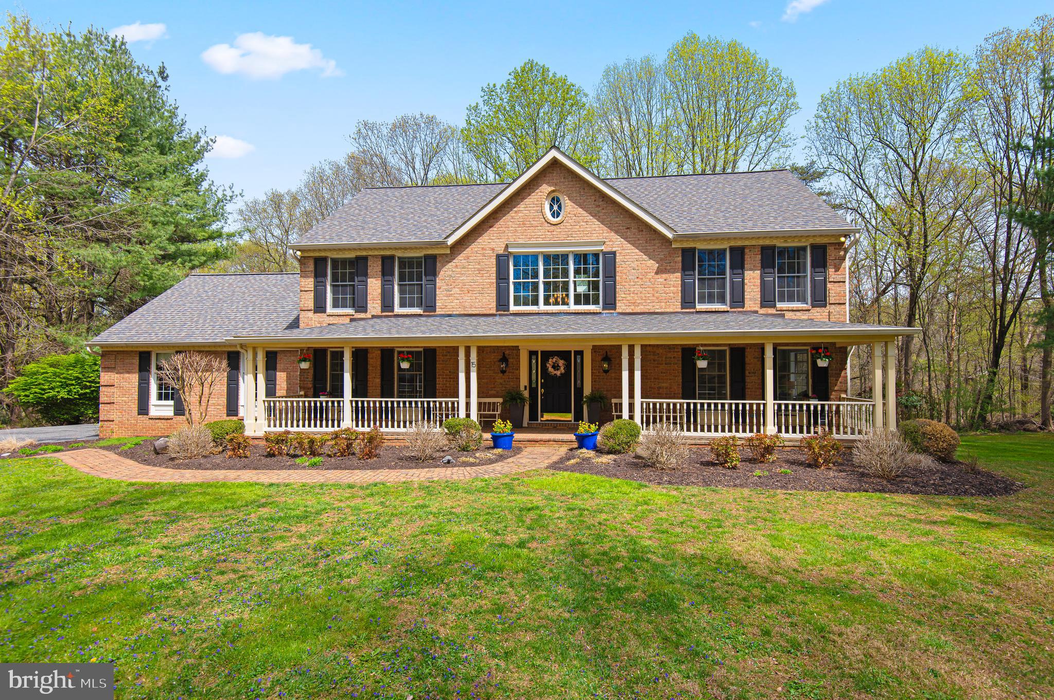Welcome to 15 Carroll Meadows Drive — a charming brick-front colonial tucked away on 3.65 acres at the end of a quiet cul-de-sac in Baldwin.  Set down a private driveway, this home offers the perfect blend of privacy, space, and functionality, all framed by mature trees, wooded views and a level, partially fenced-in yard with beautiful views. The main level boasts a thoughtful layout with a living room, formal dining room, and an open-concept kitchen and family room that’s ideal for everyday living and entertaining.  The renovated kitchen features Quartz countertops, an oversized island, breakfast bar, double ovens, stainless steel appliances and two pantries.  Work-from-home needs are covered with a main-level office featuring custom built-ins and multiple workspace options. Just off the kitchen, a convenient mudroom includes laundry and a custom pet washing station, with easy access to the attached two-car garage.  Step outside from the family room to a spacious composite deck—perfect for relaxing or dining al fresco while overlooking the private, wooded backdrop.  From here, take in the expansive outdoor space, including a huge front yard and large rear yard - ideal for entertaining, gardening or simply enjoying nature.  Upstairs you’ll find four bedrooms, including a spacious primary suite with two walk-in closets and a renovated en suite bath. The finished lower level offers additional living space with a full bath - perfect for a family room, gym, or extra home office - with slider doors that walk out directly to the back yard.  This is your chance to enjoy the peace and privacy of country living with all the modern conveniences—don’t miss it!  This amazing location is just a short ride to several parks, vineyards, golf courses and restaurants.  Enjoy peace of mind with recent updates, including a roof replacement in 2018 and a newly installed hot water heater in March of this year.  Sellers are offering a 1yr First American home warranty at closing.