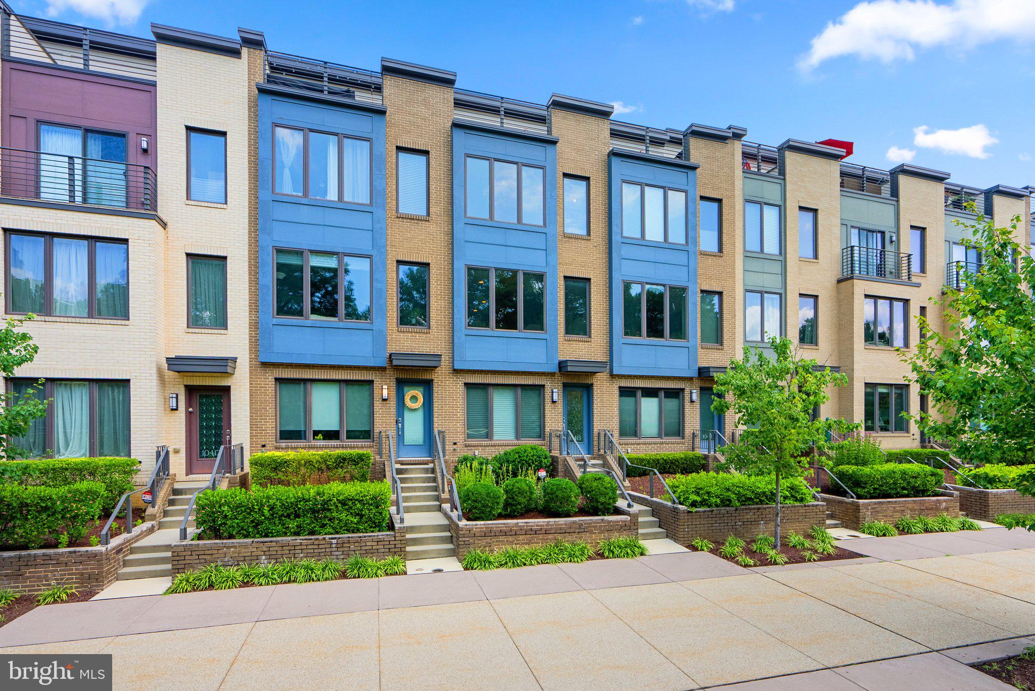 Gorgeous 3BR/3.5BA townhome located in desirable Montgomery Row. Flooded in natural light, this contemporary design has gleaming hardwood floors on main level, oversized windows and a rooftop terrace. The Burch model features an open floor plan with a gourmet kitchen with stainless steel appliances, granite countertops and large breakfast bar flowing into spacious living and dining rooms. Upstairs, a master bedroom with en-suite bathroom and a large walk-in closet.  A second bedroom with en-suite bathroom and full-size stackable washer and dryer complete the second floor. Up to the top floor you'll find another bedroom, with en-suite bathroom and a large loft space that steps out to a private rooftop deck. All this plus a tandem 2-car garage, minutes to Montgomery Mall, Wildwood shopping center, Grosvenor Metro and 270/495.  Application link: https://apply.link/5B5brPQ