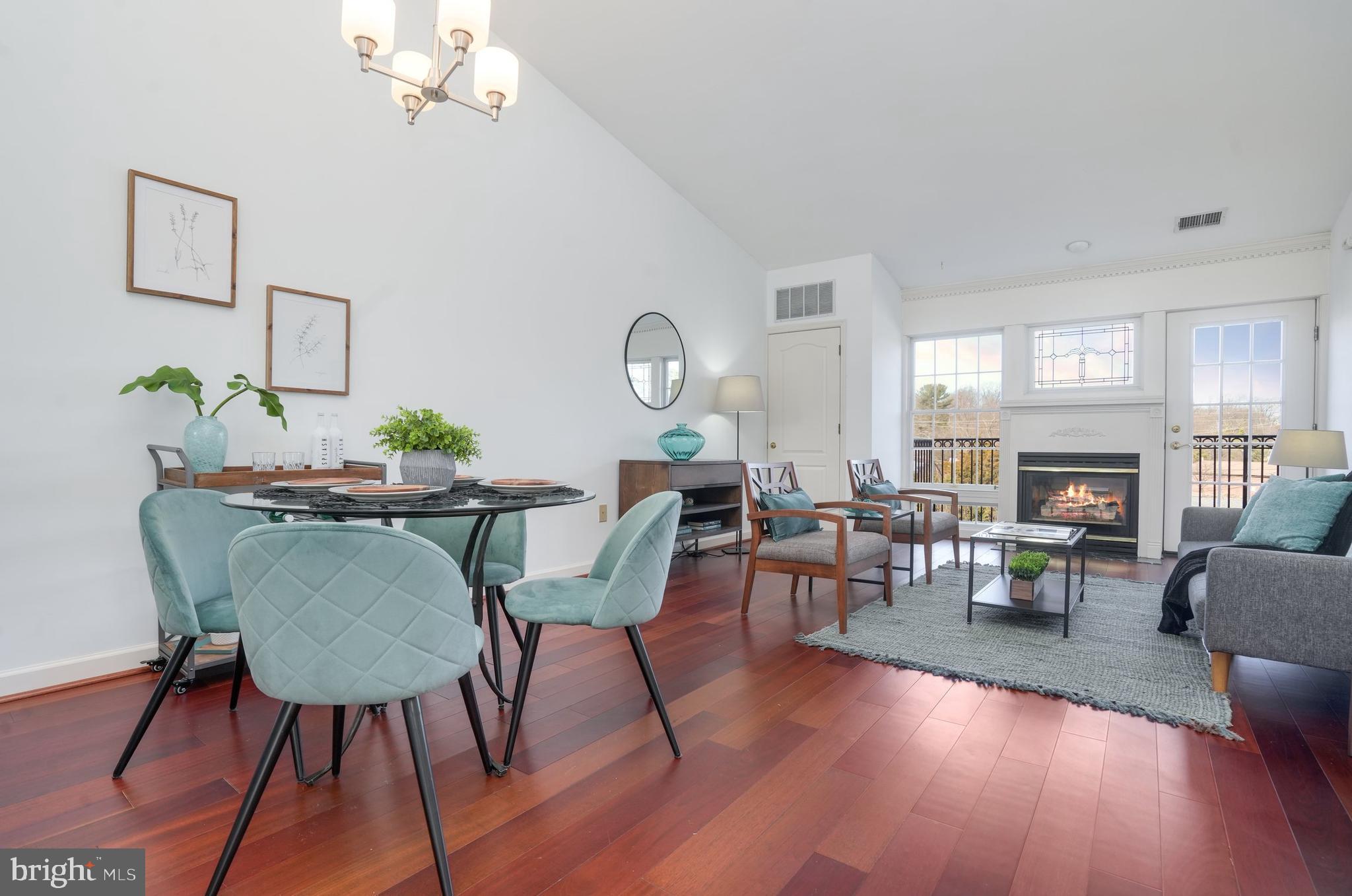 TERRIFIC VALUE!! Top floor unit with dramatic 14’ vaulted ceilings in dynamite location close to downtown Falls Church, East Falls Church METRO, and  66.  Short drive to Ballston and DC. INVESTOR AND PET FRIENDLY.   All brick construction features front porch  and rear balcony. Expansive living room/dining room  combination features gas fireplace with charming leaded glass window above, floor-to-ceiling windows, and  opens to private balcony with wrought iron railing. New paint, carpet, and dishwasher  2023. Heavy duty HVAC 2019.  Updates in 2016  include Brazilian cherry flooring, stainless kitchen appliances (GAS COOKING!!), and  ceramic tile backsplash. 2 deeded parking spaces (2087 + 2091) and guest pass come with this spacious home. Great opportunity to own in Falls Church  close to restaurants, shopping,....Walk Score 76 "Very Walkable"  and W&OD Trail....Bike Score 84 "Very Bikeable". NEW CARPET...PLEASE WEAR  SHOE  COVERS PROVIDED OR TAKE YOUR SHOES OFF...MANY THANKS!