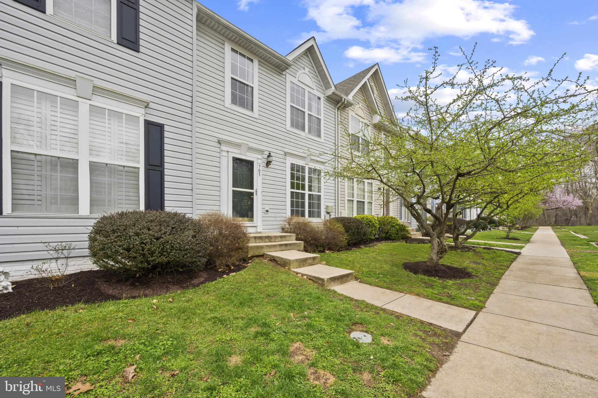 Nestled within the desirable community of Piney Orchard, this charming townhome offers an inviting space with three bedrooms, two full baths, and two half baths. The home welcomes you with a cozy living room and a separate dining area, perfect for entertaining guests. The well-equipped kitchen leads to a delightful deck, providing an ideal setting for al fresco dining and relaxation. Upstairs, the owner's bedroom boasts a vaulted ceiling, an attached bath, and a convenient walk-in closet. Two additional bedrooms and hall bathroom complete the upper level. Downstairs, the lower level family room provides a cozy retreat, complete with a fireplace for added warmth and comfort. The First level flooring has been newly replaced.