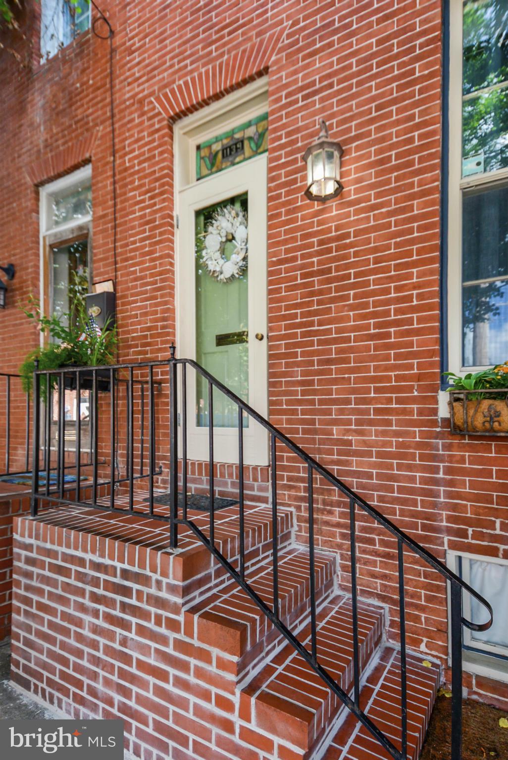Character abounds in this spacious 3 BR town home on a tree lined street in Federal Hill.  Chef's eat in kitchen with a sunny breakfast nook. Patio/garden just off of kitchen.  Original hardwoods, exposed brick, stained glass. MSTR bed has den/office area with ample closet space.  Second floor guest room with laundry set up. Third bedroom also has an office/den area. Pool Bond