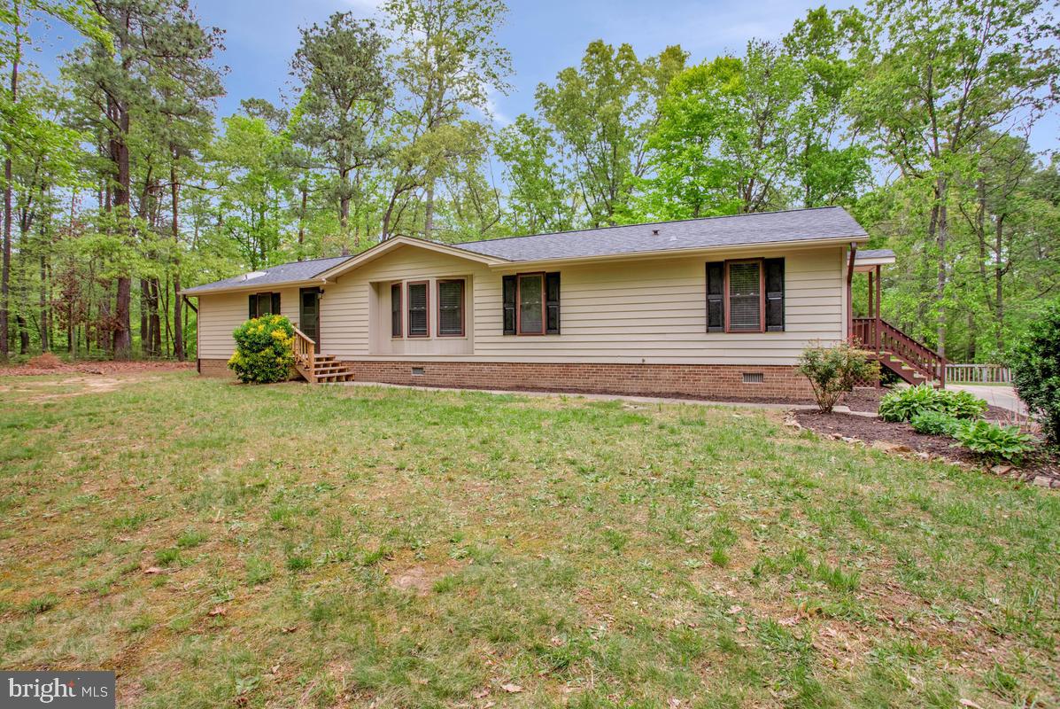 Welcome to 27172 Burning Oaks Drive in Mechanicsville, MD—where comfort, charm, and space come together on a stunning 4.46-acre setting. This beautifully remodeled 3-bedroom, 2-bath home is truly move-in ready and offers the perfect blend of modern upgrades and peaceful country living.

Step inside to discover a warm and inviting interior featuring updated finishes, a spacious layout, and abundant natural light throughout. The sunroom is a true highlight—an ideal place to enjoy your morning coffee, unwind with a good book, or take in serene views of the surrounding property in every season. The home also features all new appliances, along with a brand-new roof and HVAC system, offering peace of mind and modern efficiency for years to come.

Outside, the possibilities are endless. With 4.46 acres of open space, you’ll have room to roam, garden, entertain, or simply enjoy the privacy and tranquility of your own retreat. The oversized 3-car garage with a dedicated workshop area is perfect for car enthusiasts, hobbyists, or anyone in need of extra storage and workspace.

Whether you’re seeking a peaceful escape or a place to spread out and make your own, this property offers a rare combination of modern comfort, thoughtful updates, and country charm—don’t miss your opportunity to call it home!