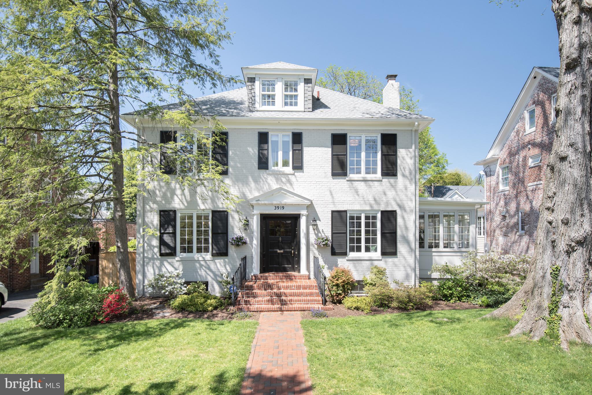 PHENOMENAL VALUE IN CHEVY CHASE VILLAGE -  AN A+ LOCATION AND SUPERB CURB APPEAL JUST BLOCKS TO METRO AND SHOPPING! BE SURE TO CHECK THIS ONE OUT! 
Built in 1933 this handsome south facing center hall colonial has been expanded and renovated and offers approx 5,000 sf of space (3,800 finished) over four levels. The welcoming entry opens to the lovely foyer and light-filled interior which features 9’ ceilings on the main level. A generously sized living room with fireplace and separate dining room are on either side of the foyer, and a main level office/sunroom is located off the living room. The spacious chef's kitchen with island features custom cabinetry, new countertops and a breakfast area, and is adjacent to a family room with a fireplace. Five bedrooms (one currently serving as the primary closet) and three renovated baths are on the second level, including the primary bedroom with ensuite bath. The third floor is home to a potential sixth bedroom, a sitting room and incredibly generous storage space (also a candidate for future expansion). A recreation room, laundry room, bonus space, quarter bath and utilities are found in the lower level, which has a walkout stairway to the rear patio and yard. A shared driveway accesses a two-car garage, and the fenced, level yard with its ample green space, patio and deck is ideal for entertaining and play and can be accessed from the sunroom, family room and kitchen.  Recent improvements include the exterior paint, system updates, new kitchen countertops, cooktop, and more. Just over the DC line on the west side of coveted Chevy Chase Village, this home is in a dream location. Metro and the shops and restaurants of both Connecticut Avenue and Friendship Heights are within blocks, as are many parks and playgrounds, schools and clubs. Downtown DC and points in Maryland, Virginia and beyond are easily reached, including all area airports. The Capital Crescent trail and Bethesda are also nearby and enjoyed by Village residents. Chevy Chase Village has its own post office, police department and administration, providing residents many amenities including daily house checks by the police department to households whose members are away, twice weekly trash collection, weekly bulk pick up, numerous community parties, events, activities and more. So close to everything, this location is the perfect choice for those who desire a mature, established neighborhood with all of the conveniences of the city right at hand.