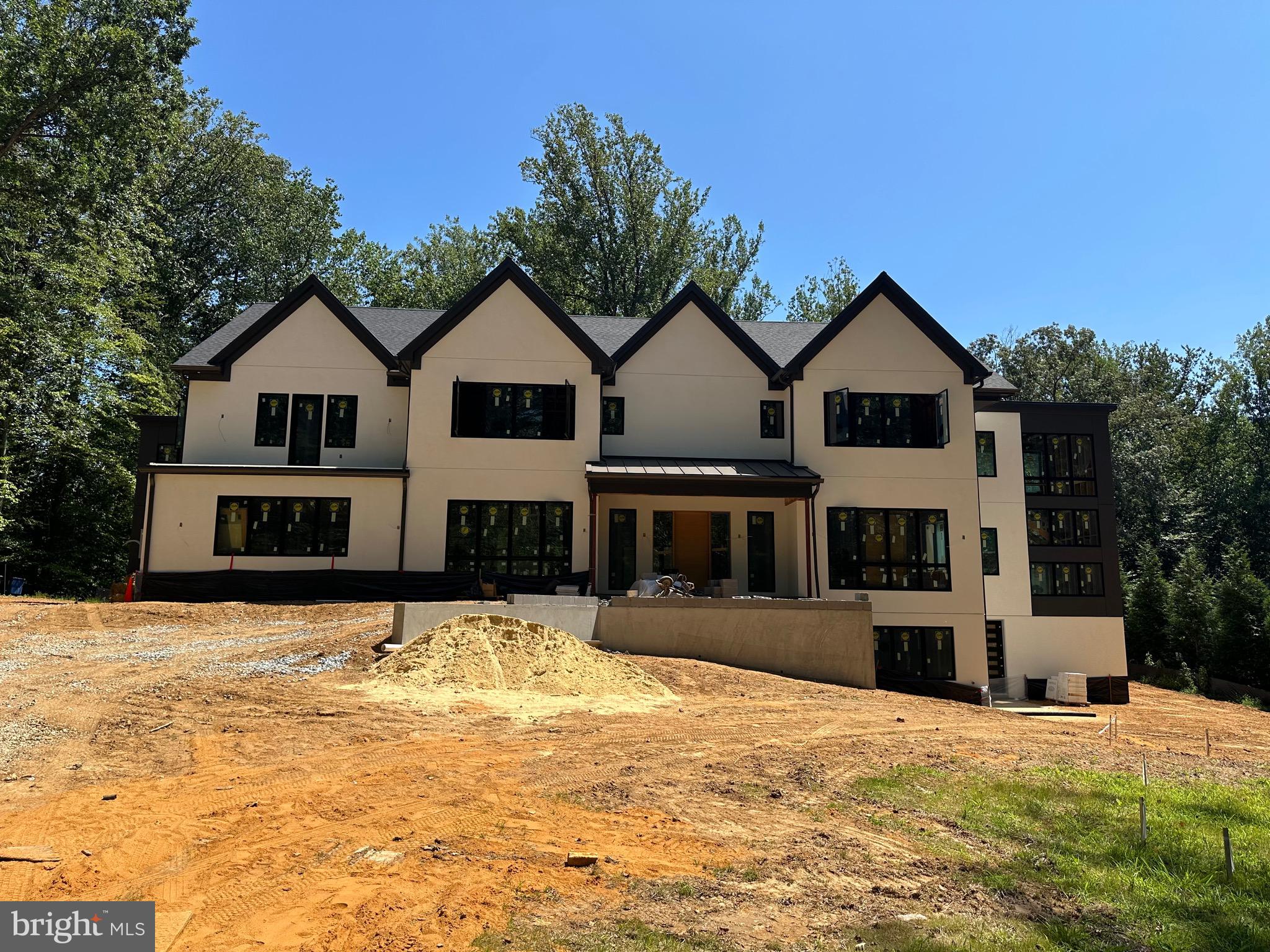 FINAL TOUCHES - WILL BE COMPLETE BY 6/15.

OPEN HOUSE ON 6/21 FROM 1:00-4:00PM.

Location, location, location! Are you seeking something distinctive on the market? Look no further. Ideally situated in the highly desirable and sought-after neighborhood of Bannockburn in Bethesda, this home is sure to have it all, offering a rare opportunity to own a meticulously built modern contemporary home. This property is being built by Kader Construction, whom takes a hands-on approach to building - allowing the quality of the home to speak for itself. It will feature the highest-end finishes and materials throughout, boasting an approximate living space of 12,757 square feet on a leveled lot of 39,932 square feet. This incredibly premium plot of land provides seclusion and privacy for the residence via thoughtfully placed trees and greenery. Additionally, the home is situated deep within the lot, providing an elevated sense of tranquility. Step inside this light-filled, modern home with an open floor plan and enjoy approximately 8,850 square feet of living space—an impressive area that ensures everyone is well accommodated. The home features upgraded recessed lighting, naturally aged, high-grade 7-inch engineered hardwood floors, and top-notch materials. Featuring a total of 7 bedrooms and 7.5 bathrooms, this immaculate new build is sure to impress! The extensive and high-end gourmet chef’s kitchen will wow you and all of your guests, showcasing the finest appliances with a full Thermador stainless steel appliance package with custom-crafted wood cabinetry throughout. The Calacatta Quartz solid countertops and oversized island will provide you with ample space to host friends and family, showcasing views through walls of windows towards the rear yard. Additionally, you will find a main-level bedroom with a full bathroom, as well as formal dining, living, and family rooms, a well-equipped butler's pantry, and an expansive rear porch featuring both a screened and an unscreened section. Upstairs, you'll find five bedrooms and five full bathrooms, including the expansive owner’s suite, which features a massive walk-in closet and an en-suite bathroom with an oversized shower enclosure. The bathrooms all feature porcelain tiling and designer fixtures and hardware. Each bedroom has an en-suite bathroom and a walk-in closet, allowing flexibility for friends, family, and guests. Also on this level is a bedroom-level laundry room and several balconies overlooking the gorgeous, partially wooded lot. On the lower level, there is a bonus bedroom and full bathroom, ideal for guests, as well as a nanny, an au pair, and an additional laundry room. The space also features a sauna and steam room, both of which have cedar walls and a cedar bench. Additional features include a massive side-load 3-car garage ready for EV charging, a large rear-facing deck, multiple balconies, a spacious, elongated driveway with front door access, and an abundance of windows throughout the entire residence, allowing the outside in. Minutes away from downtown Bethesda, shops, restaurants, groceries, and easy access to I-495 and I-270. The photos and sizes provided are conceptual. Call for more information and references.