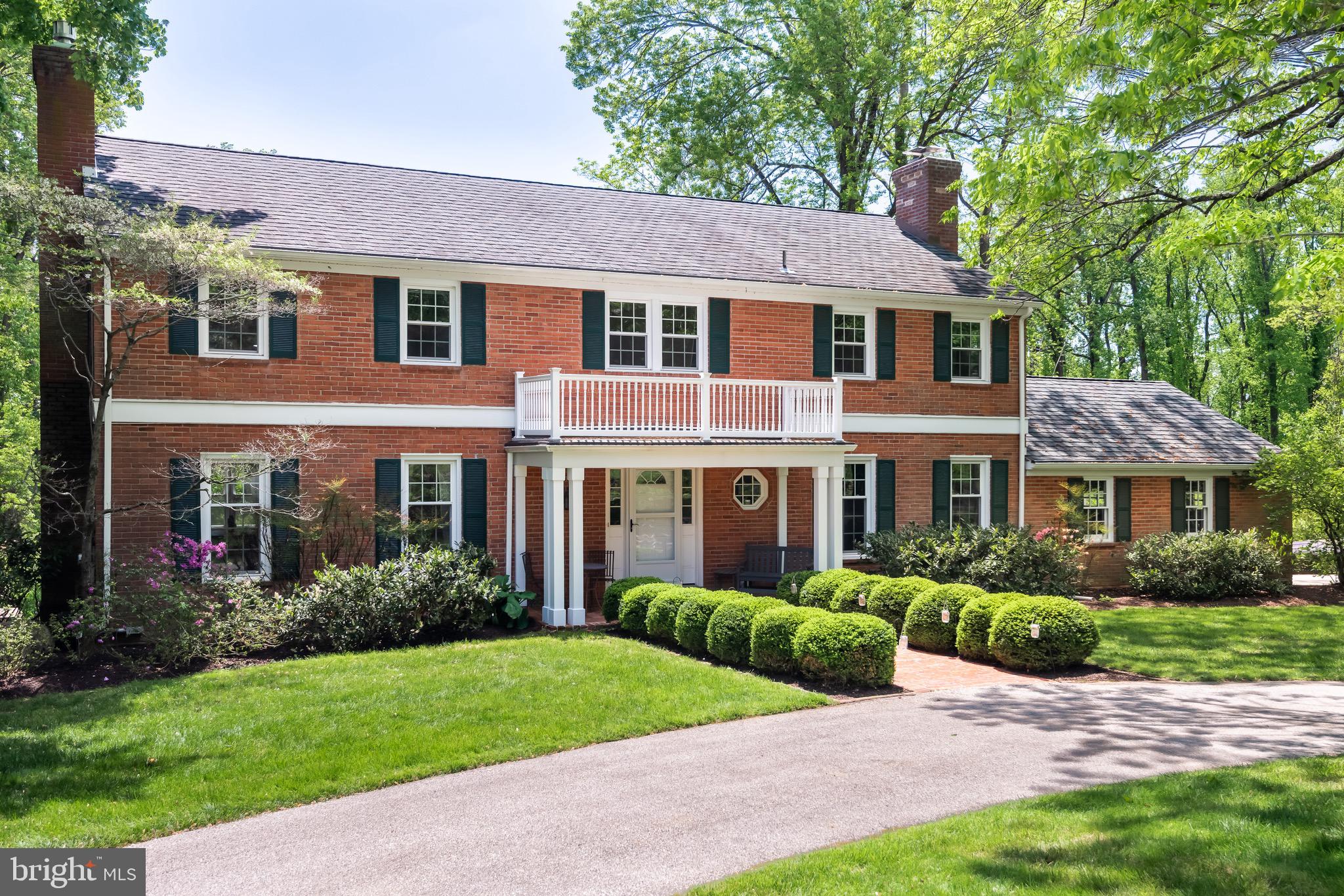 Welcome to 2063 Fox Creek Road, a distinctive all-brick colonial, located in one of Easttown Township’s most magical locations! This home features a stately curbside presence with circular driveway and matured landscaping and is sited on a beautiful 1 ½ acre lot backing onto protected lands. This property offers unparalleled privacy yet is located in a community-oriented neighborhood. The home offers a timeless and open floor plan with hardwood floors throughout the two main levels. Inviting entry foyer leads to a lovely living room and family room, both fireside, one gas and one wood-burning with gas hook-up. The family room features an eye-catching floor-to-ceiling stone fireplace with raised hearth, exposed beams and an abundance of built-ins for book collectors, art collectors and cherished family photos. A fully remodeled all-white kitchen accented with stainless steel appliances now opens to the dining room, making for a large gathering space for day-to-day ease and entertainment alike. The kitchen leads to a newer and enlarged composite deck with access to a new flagstone patio, complete with pergola and overlooks a peaceful and serene setting of a beautiful backyard that can be enjoyed throughout the year. The second floor offers remarkable living space with five generously sized bedrooms, including a primary suite with a nicely sized bath, extra generous vanities and a highly functional hall bath also with vanity featuring two sinks. The closets in the home have been professionally outfitted as well. The large finished lower level features an additional 1,100 sq. ft. of daylit space with windows and walkout to patio. Enjoy a large recreation room, separated exercise room, newer Full Bath and ample storage space. The home has been extensively updated with replaced mechanical systems including a converted HVAC system with natural gas (previously oil heat), heat pump, gas water heater, whole-house air purification system, whole-house water filtration system, generator and new electric panel. $350,000+ in improvements made by the current homeowners also include replacing the roof with attractive Grand Manor shingles, installing new interior doors and energy-efficient replacement windows and more. Enjoy award-winning Tredyffrin Easttown Schools, including the coveted Beaumont Elementary School. Quick access to Main Line popular shopping and dining destinations, a host of private schools, private clubs, Upper Main-Line YMCA and area nature preserves for every nature lover at heart. Easily accessible to PHL International Airport, local R-5 commuter & AMTRAK rail lines. A true town & country lifestyle awaits the next lucky homeowner!