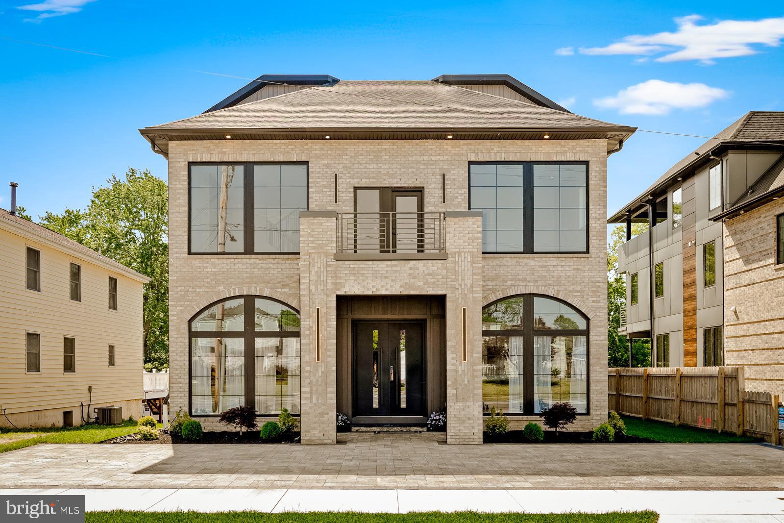 Welcome to 9741 Krewstown Rd, a stunning custom-built home featuring 6 spacious bedrooms and 4.5 luxurious bathrooms. This beautifully designed residence showcases engineered hardwood flooring throughout and an incredible primary suite spanning over 1,000 square feet, complete with a spa-like waterfall shower and an oversized walk-in closet. As you step inside, you’re greeted by breathtaking 25-foot ceilings and a dramatic 25-foot tiled fireplace that creates a true statement centerpiece in the living space. The home also features impressive 12-foot ceilings on the first floor, while the second and third floors offer elegant 10-foot ceilings, creating an open and luxurious feel throughout. Every room is enhanced by oversized 8-foot doors that add to the home’s grand design and modern appeal. The first floor also includes a private office space perfect for working from home or additional flex use. The fully finished basement includes two additional bedrooms and a full bathroom, making it ideal for guests, extended family, or extra entertainment space. For added comfort and efficiency, the property is equipped with 3 separate AC units and also comes with a 10-year tax abatement, offering tremendous long-term value. Every detail of this home was thoughtfully crafted to combine luxury, comfort, and modern elegance.