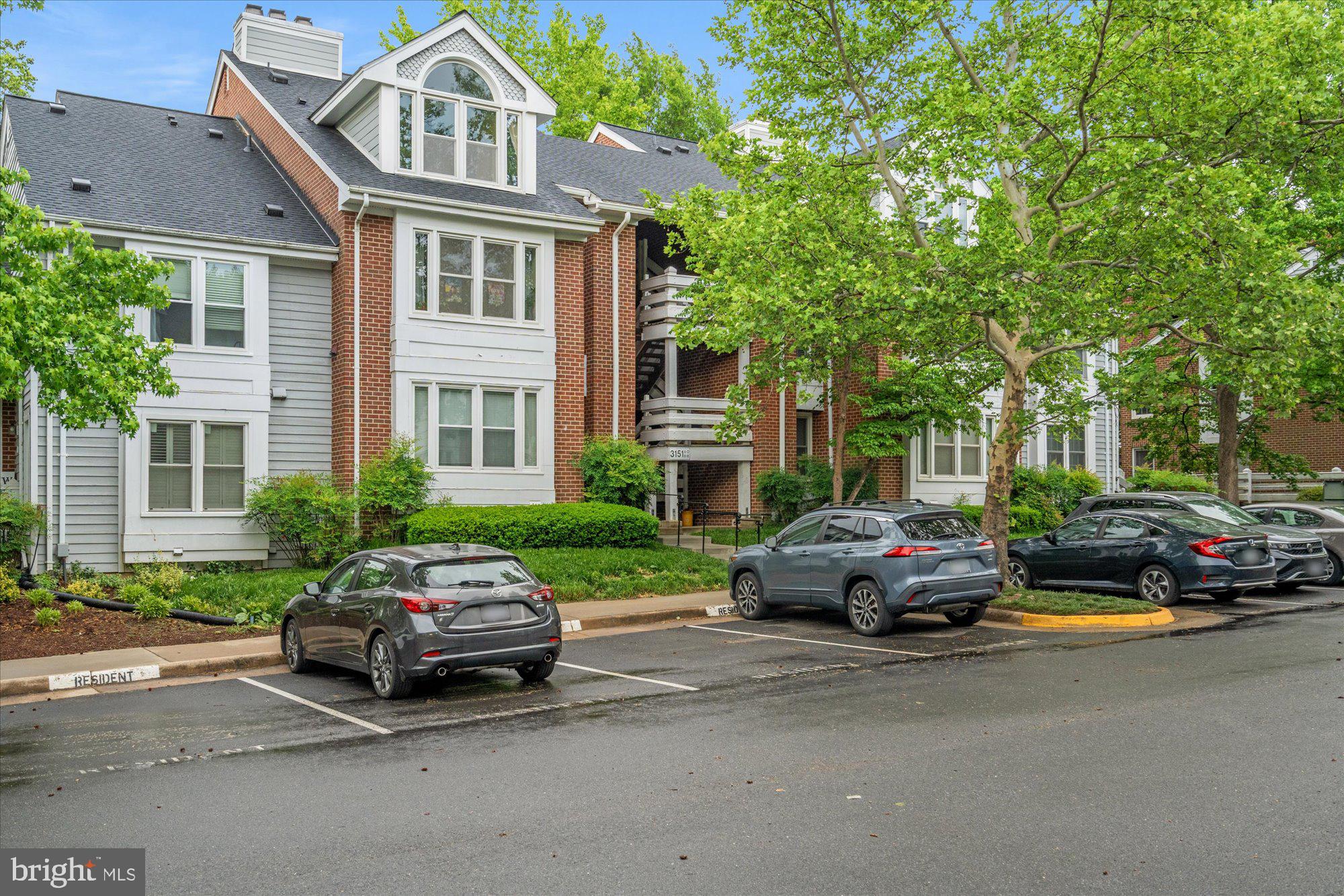 Welcome to this conveniently located 1br/1ba top level condo with over 950 sqft set in a peaceful wooded setting! Light filled open floor plan with vaulted ceilings and wood burning fireplace. Updated kitchen with granite tops, stainless steel appliances, recessed lights and a cut out to the living area allowing you to converse with guests while in the kitchen. Sliding glass doors in the living room and the kitchen door give you easy access to your private balcony where you can extend the party or simply enjoy a private lake side view. Spacious bedroom with vaulted ceilings, cozy reading/office nook, and updated dual entry full bath with additional separate vanity. Large storage closet, newer washer/dryer, HVAC (with new UV light) and water heater were replaced in 2018. Other community features include a beautiful pool with clubhouse, and pier along the lake. Residents have one reserved parking space and 3 guest passes! Only minutes to several Metro stations, the Mosaic District, downtown Falls Church, and Tysons Corner.