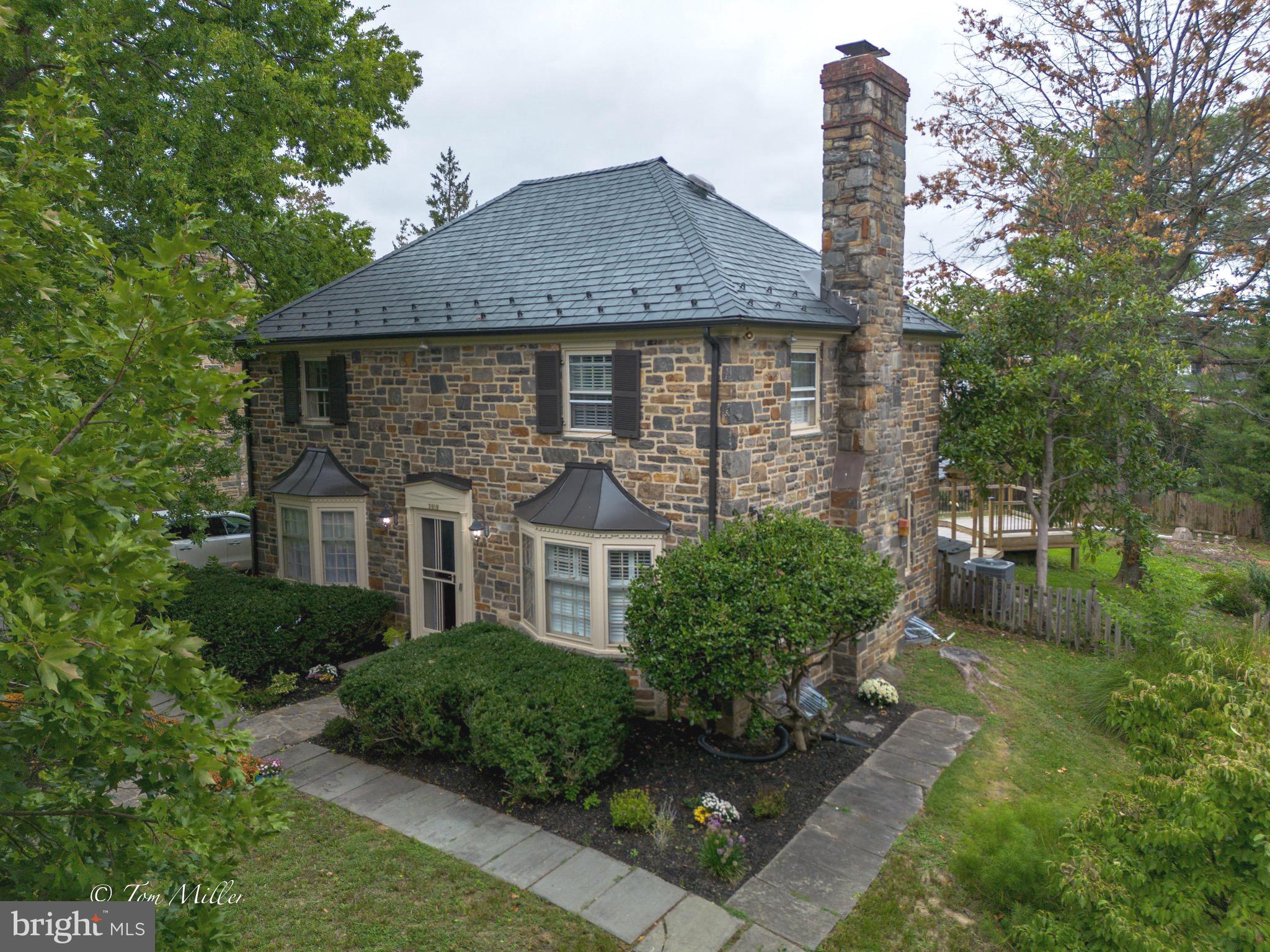 A Charming Guilford Stone Home 
This lovely home offers wood floors through out, living room with WB  fireplace, crown molding and plantation shutters,  first floor office with stone floors, kitchen complete with granite counters and wood floors,  the spacious dining area  is adjacent with lots of  natural light!
 There is a  bonus room with a stone floor adjacent to the kitchen.
The second level has 3 bedrooms and 2 full baths.
The lower level is nicely finished with a rec room, powder room, laundry and storage.
There is a 4th level  which is unfinished, which could be finished as usable space,
There is a huge rear deck, great for entertaining and all fenced yard.
A new slate roof was recently installed 80K and a new aIr conditioner unit.
This is a great location, convenient to restaurants, shopping and more!