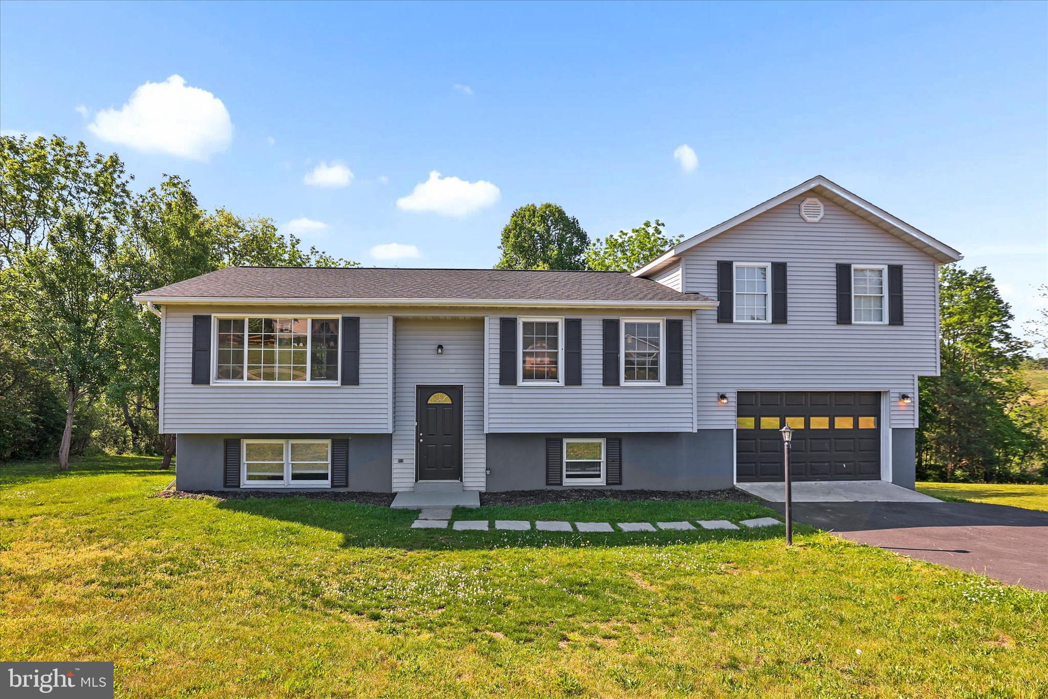 Welcome to 253 Vegas Dr in Hanover! This beautifully maintained 3-bedroom, 2-bath sits on nearly an acre in the South Hanover setting with a spacious backyard perfect for entertaining, relaxing, gardening or enjoying the outdoors. Inside you'll find luxury vinyl plank flooring installed in 2024, granite countertops, spacious living areas, and a flexible bonus room above the garage that's perfect for a home office, playroom, or additional living space. Major updates completed in 2024 include the luxury vinyl plank flooring, appliances, roof, heat pump and water heater - offering peace of mind for years to come. The finished lower level provides even more room to spread out with added privacy for guests or family. Offering a quiet setting while remaining close to the MD line, local dining, shopping and outdoor activities. This home offers the perfect blend of comfort, space and convenience all in one. Don't miss the opportunity to make it yours!