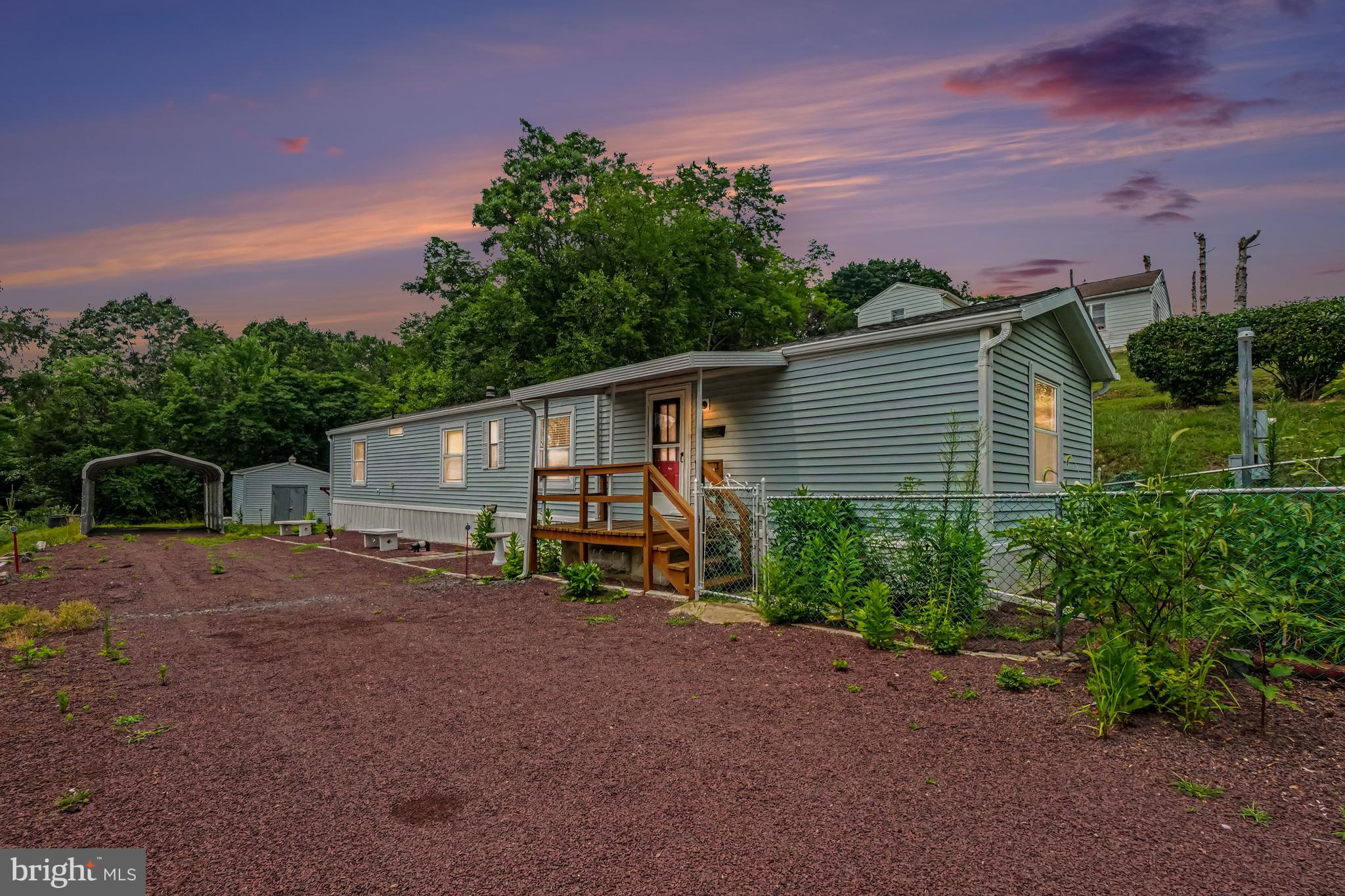 Enjoy peaceful country views from both the front and back porches of this 2BR, 1.5BA manufactured home situated on a spacious 0.36-acre lot in Pottsville. Inside, you’ll find a comfortable and functional open layout. Outside, the large driveway provides ample off-street parking, complemented by a convenient single carport. A storage shed is included for your lawn equipment and outdoor essentials. The home features oil forced-air heat, and central air conditioning for year-round comfort. Whether you’re looking for your first home, downsizing, or seeking an affordable investment, this property offers a great combination of value, space, and scenic surroundings.