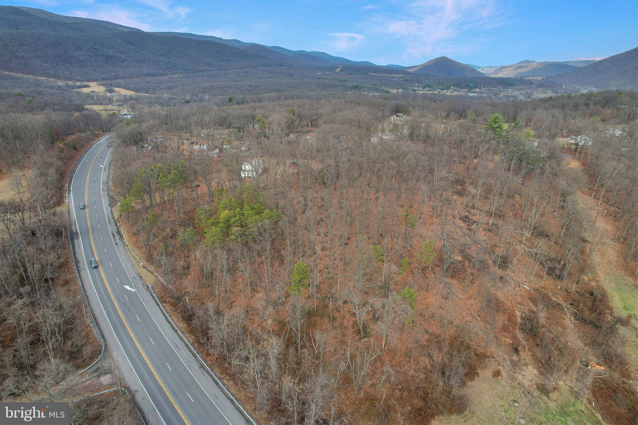 Great location featuring mostly flat land with endless possibilities!   Discover the potential of this unique property featuring more than 7.5 acres of land divided into 5 separate parcels.   Located in a quiet, rural setting, this expansive property offers excellent opportunities for development, investment, or creating a multi‑parcel homestead.  Property is located on US Route 220 just minutes from the town of Keyser and offers peaceful country living with convenient access to local amenities. such as restaurants, shopping and banks.   With easy access, ample acreage, mature trees, and flexible parcel configurations, this land is ideal for buyers seeking space, privacy, and long‑term potential. Whether you're planning to build your dream home, use the property for development, start a small farm, or simply invest in land, this property is the perfect place to bring your vision to life.   Property also includes an existing house that is currently uninhabitable.