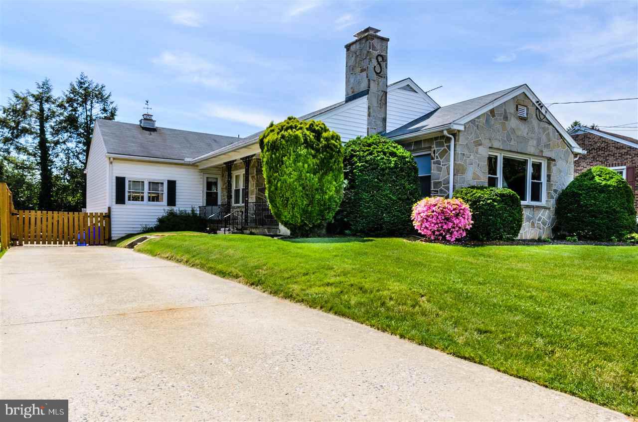 Charming updated stone rancher blends character and charisma: open floor plan w/ great flow, exceptionally large living rm with stone fireplace, large dining rm w/ presence, remodeled kitchen, authentic hardwood floors throughout, tile floors, unfinished basement used as living space, huge storage area above, cozy side porch, attractive newly fenced backyard,