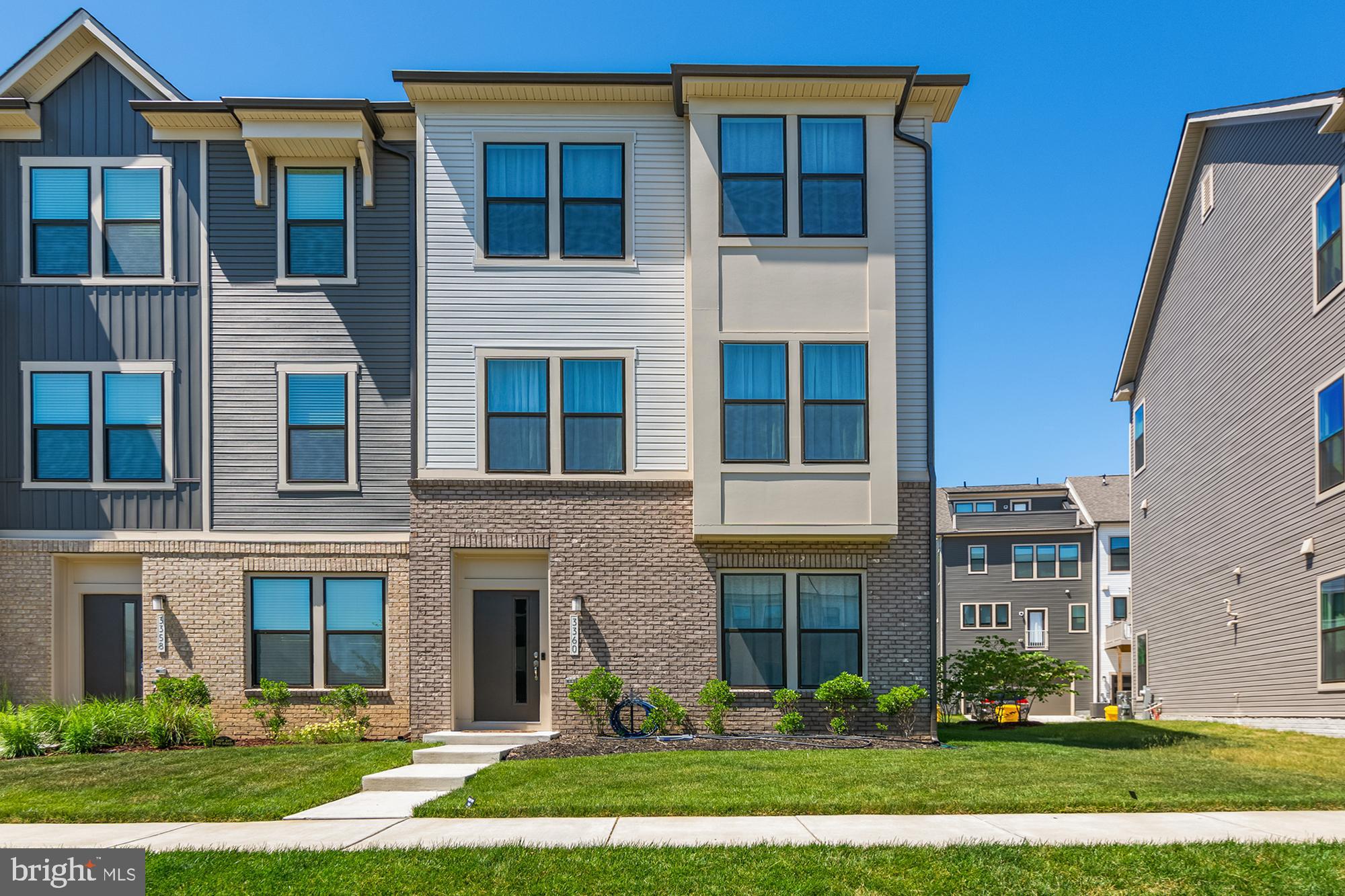 Welcome to 3360 Cormorant Drive, one of the larger and most sought-after floorplans in the community. This stunning 3-bedroom, 3 full bath, 1 half bath townhome offers the perfect blend of luxury, functionality, and thoughtful design across multiple levels of beautifully appointed living space.

This home is move-in ready and loaded with enhancements that would cost thousands to replicate today. Custom built-in shelving with a rolling library ladder creates a striking focal point and elevates the home's sophisticated design. Designer window treatments and draperies have already been installed throughout, providing a polished, finished feel from day one.

The expansive open-concept main level is ideal for entertaining, featuring abundant natural light, generous living and dining spaces, and a beautifully appointed kitchen designed for everyday living and hosting alike. Upstairs, the spacious primary suite is complemented by well-sized secondary bedrooms and thoughtfully designed bathrooms, while the additional full bath provides flexibility for guests, multigenerational living, or work-from-home needs. Upper-level laundry is conveniently located near the bedrooms.

The premium homesite sets this property apart. Enjoy peaceful views of community green space from the front of the home and direct access to the adjacent community garden, creating a unique sense of openness rarely found in townhome living. A rear-entry two-car garage offers convenience while preserving the attractive streetscape.

Beyond your doorstep, the vibrant Watershed community provides a lifestyle like no other. The neighborhood is anchored by a luxurious clubhouse complete with a state-of-the-art fitness center, indoor sports simulator, aerobics/dance studio, and dedicated co-working spaces. Enjoy an incredible array of outdoor amenities, including a stunning resort-style pool, a six-lane competition pool, pickleball courts, a thrilling bike pump track, miles of nature trails, and a unique outdoor yoga terrace. Unwind at The Dell Amphitheater, relax in the hammock garden and outdoor library, or host friends at the fire pits and grilling stations. Complete with multiple playgrounds, gaming lawns, and fully fenced dog parks, every day feels like a vacation.

With easy access to major commuter routes, shopping, dining, and everyday conveniences, this is an exceptional opportunity to enjoy the benefits of new construction without the wait, uncertainty, or added expense of post-settlement upgrades.

Luxury finishes. Premium homesite. Custom enhancements. Better than new.