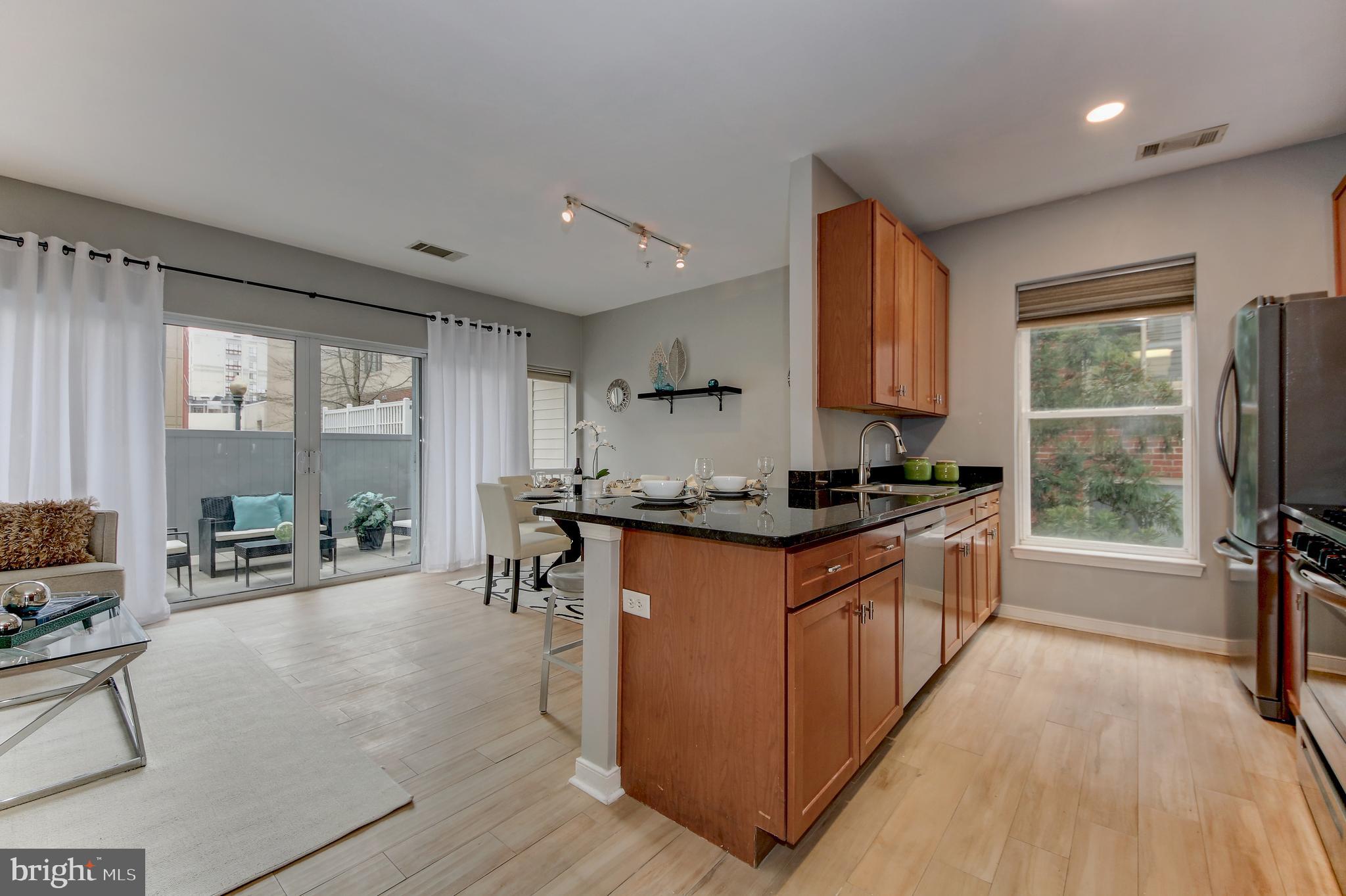 Stylish NEW listing with many upgrades and a location that offers everything:  restaurants, Metro, shops, entertainment, arts, and more.  2BR/2BA unit with a very large terrace - the perfect outdoor space we all want and need.  Many upgrades including new kitchen appliances, updated bathrooms, wood-look ceramic tile flooring, fashionable light fixtures and new washer/dryer.  This apartment is bright, welcoming and comfortable.  The perfect place for someone looking for a little more space or someone needing less.  Move in condition with easy access to everything you desire.   Easy to see.