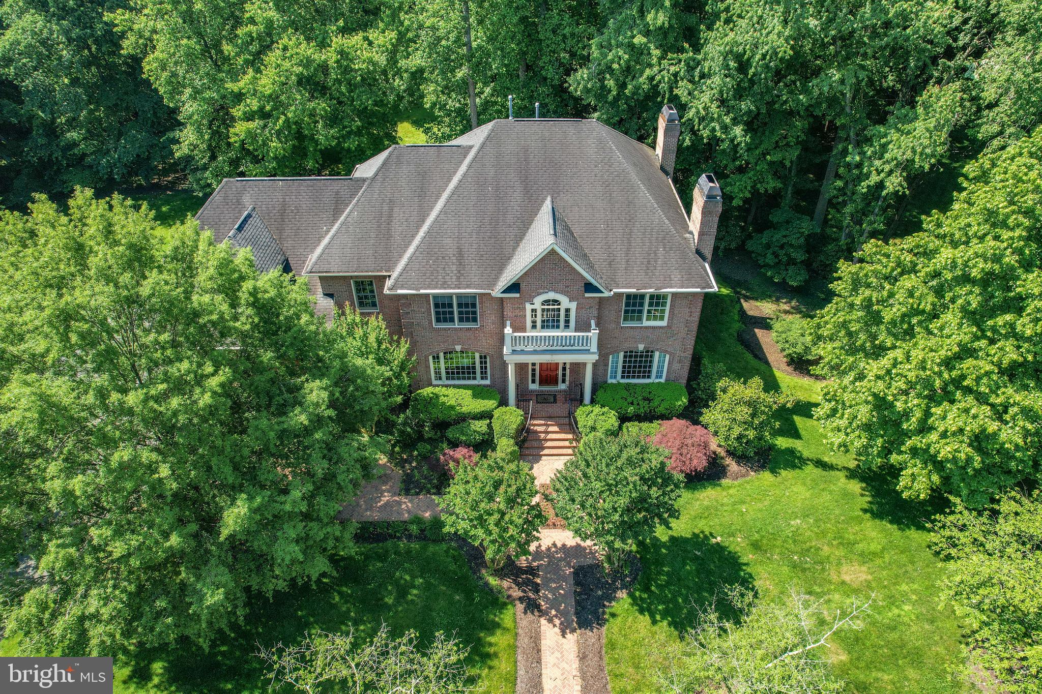 Stately 4-SIDE BRICK Colonial with 3-CAR Side-Loading Garage  *  Approx. One-Acre Homesite on a Quiet CUL-DE-SAC and BACKING TO TREES in sought-after community of Shadetree Estates  *  OAKTON HIGH SCHOOL District  *   This Home boasts 6 Bedrooms with 4 Full and 2 Half Baths  *  2 Fireplaces (one Gas, one Wood-Burning)  *  Grand 2-Story Entrance Foyer and 2nd Informal Rear Staircase  *  Gourmet Kitchen with Granite Countertops  *  Layered Crown Mouldings and Decorative Trimwork Detailing  *  Attractive Family Room BUILT-IN Cabinetry/Shelving  *  Convenient CENTRAL VACUUM SYSTEM  *  HUGE Primary Bedroom Suite w/ENORMOUS Sitting Room  *  Luxury Primary Bath  *  Upper Level Bedroom #2 with Private "Princess Full Bath", Upper Level Bedrooms #3 and #4 share "Jack-and-Jill" Full Bath  *  Fully-Finished WALKOUT Lower Level features Rec Room,  2 ADDITIONAL 'TRUE' BEDROOMS, 4th Full Bath, and CUSTOM BUILT-IN WET BAR  *  Rear Wood Deck overlooking Treed Backyard with cleared space for future Playset  *  In-Ground Irrigation System  *  Extensive Front Yard Hardscape  with Lush Landscaping to Welcome Your Guests in Style!
