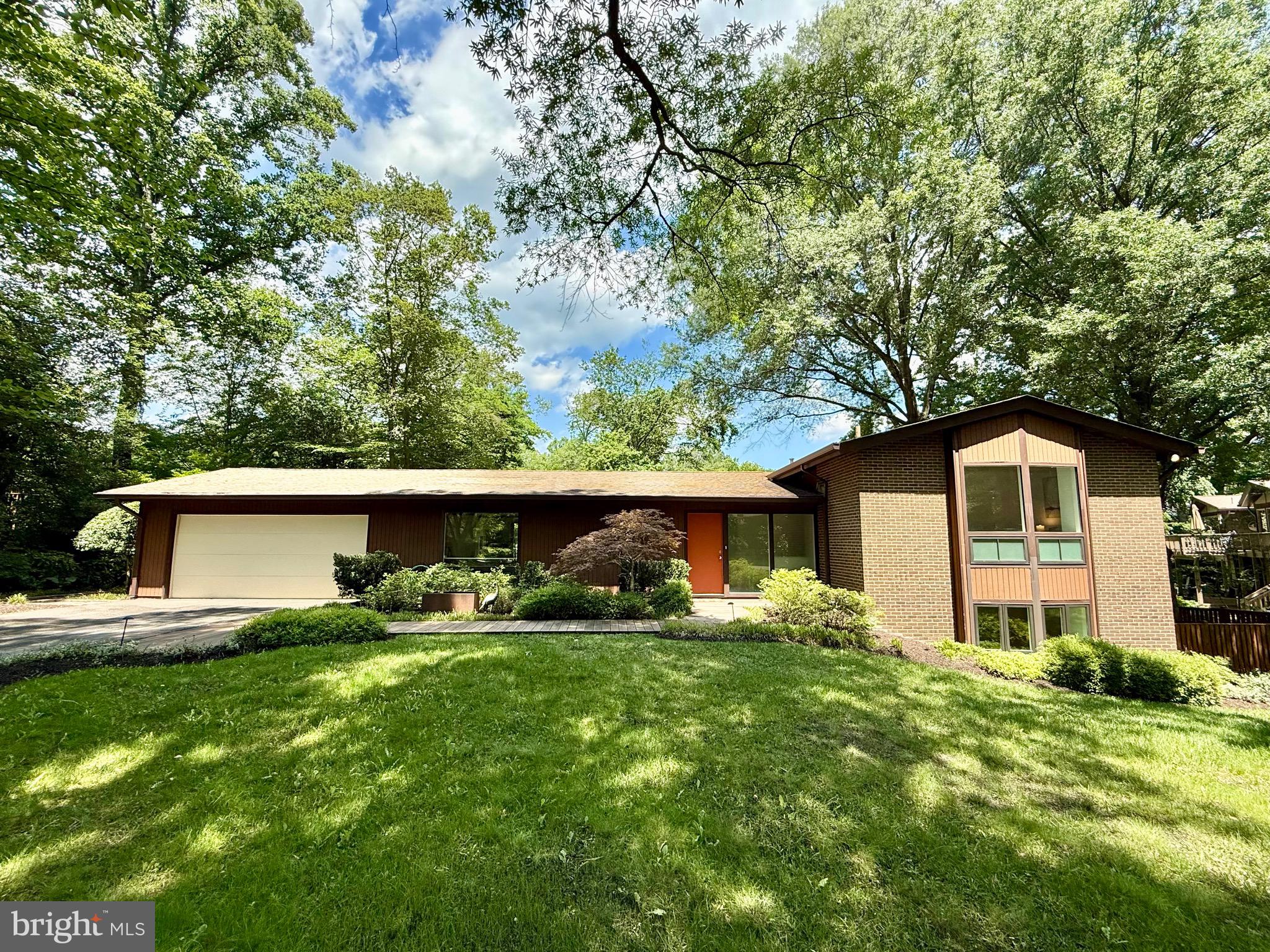 Contemporary home on half an acre with 60+ feet of waterfrontage and a dock with electricity and water. Enjoy beautiful views of the water and nature from all over the property. Little Hunting Creek offers easy boating access to the Potomac River. 
 
The home features large floor-to-ceiling windows with automatic shades that offer a beautiful view of the water, radiant-heated espresso bamboo flooring, and recessed lighting throughout. The main level features an open floorplan with skylights and easy access to the grounds and outdoor dining on the large Ipe deck.
 
The kitchen features high-end appliances, including a Miele gas cooktop, ovens, dishwasher, and a Sub-Zero refrigerator. The kitchen also features a coffee bar and a wine refrigerator.
 
All four bedrooms have en-suite baths and walk-in closets. The generously sized primary suite features a gas fireplace and a private balcony with views of the water. The lower level features a family room and a large laundry room with a utility sink.
 
The home is as functional as it is beautiful, with an attached 2-car garage and a whole-house gas generator. It also features smart home technology, a sound system in several rooms, and extensive low-voltage wiring. 
 
The Wessynton neighborhood offers a swim club, tennis courts, a boat launch, basketball courts, and walking trails. Live like you're always on vacation!