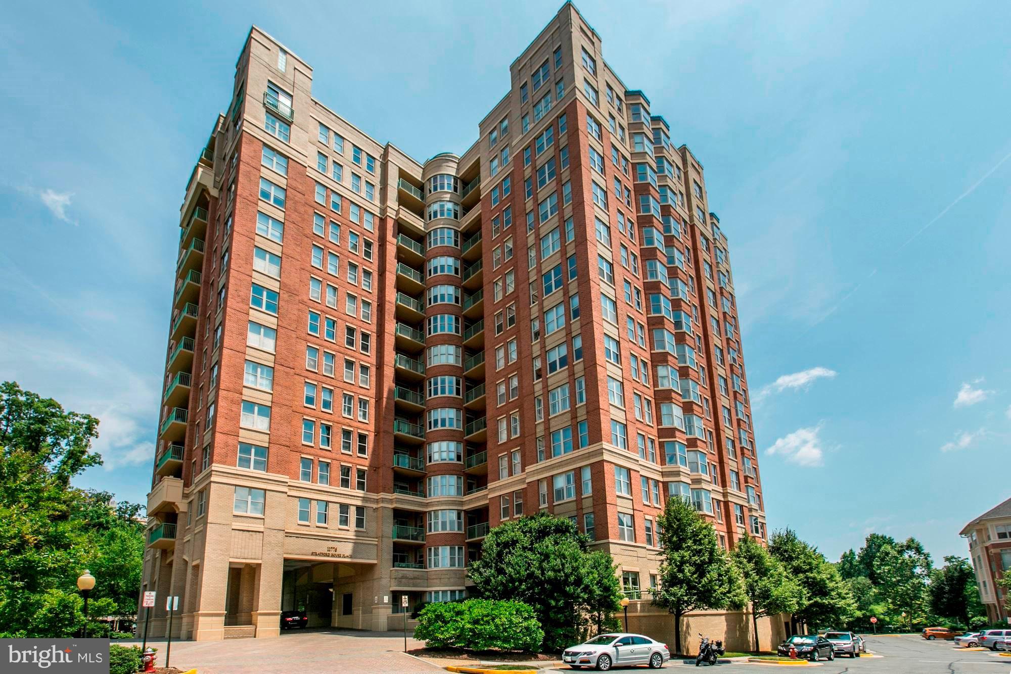 Welcome to luxury living in the heart of Reston! This beautiful 2 bedroom + den, 2 bathroom corner unit at Stratford House Place offers the perfect blend of modern comfort and urban convenience.

As you step inside, you'll be greeted by the spacious and open layout, accentuated by tall ceilings that create an airy and inviting atmosphere. The Great Room boasts a dramatic curved wall of windows, providing abundant natural light and panoramic views. Whether you're relaxing by the fireplace or entertaining guests, this space is designed for both comfort and style.

The condo features a well-appointed kitchen with updated appliances, perfect for whipping up culinary delights. Two balconies provide additional outdoor living space, ideal for enjoying morning coffee or evening sunsets. 

The two bedrooms come complete with walk-in closets, ensuring ample storage space for all your belongings. The den offers flexibility for a home office, media room, or additional guest space, adapting to your lifestyle needs.

Stratford House Place is not just a residence; it's a lifestyle. This concierge building offers top-notch amenities, including a Common Room for social gatherings, a fully-equipped Gym for your fitness needs, a Business Center for remote work, and a refreshing Pool for relaxation on warm days.

The location is unbeatable, with the convenience of being within walking distance to shops, restaurants, and the metro. Don't miss the opportunity to make this beautiful condo your new home. Experience the epitome of urban living at Stratford House Place in Reston Town Center. Schedule a showing today!