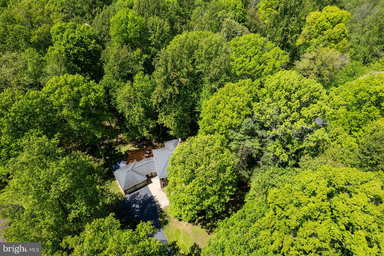Put this lovely home on your "must see" list if you are looking for an impeccably maintained home set on almost an acre lot that offers a peaceful, private setting surrounded by mature trees, tranquil views, and wildlife, but is still close to everything.  Offering nearly 5,000 square feet of smart living space with 5 bedrooms, 3.5 baths and an incredible walk out lower level with in-law/au pair suite this home lives large with exceptional space for multi-generational living.  

The home boasts stately appeal with a long drive accented by beautiful landscaping and lighted pillars leading to an impressive brick front Colonial complete with paver walkway leading to the front door.  The main level features a two story entry, and a smart floor plan that offers both formal and informal spaces for entertaining or everyday living.  The living room and dining room are ideal for hosting special events, while the family room offers a cozy wood burning fireplace and the main level library provides an ideal work from home space.  The kitchen features on trend white cabinetry and quartz countertops with a sunny breakfast area and access to the deck for easy outdoor dining or peaceful evenings enjoying the sounds of nature. The main level is rounded out by a glass enclosed breezeway and a convenient laundry room. Hardwood floors grace the main and upper levels, and natural light flows throughout the many windows providing lovely views from every room.

The upper level features a wonderful primary suite with sitting room or nursery plus a renovated bath with soaking tub, walk-in shower and dual vanities. Three additional spacious bedrooms all with lovely views share a hall bath.  The finished walk out lower level is ideal for multi-generational living with a spacious recreation room with custom cabinetry, a wet bar and a private guest suite with walk-in closet and access to its own private deck..

Outdoor living truly shines with muti-level decks, and a lush lawn surrounded by mature trees, offering exceptional privacy, beauty, and a sense of retreat. 

The home is zoned for the desirable Madison High School pyramid. The location is hard to beat, with quick access to the Dulles Tech Corridor, Commuter Routes, the Silver Line Metro,  and Dulles Airport, along with shopping and dining at Reston Town Center and Fairfax Corner just minutes away.


Thoughtfully updated and meticulously cared for, this home provides a setting that feels worlds away while remaining so close to everything.  Make it yours today!
