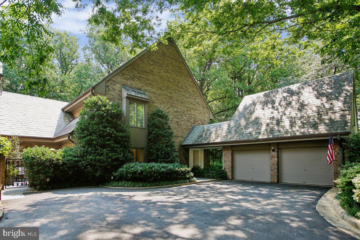 One of the few homes in prestigious Merrywood on the Potomac to offer both an oversized four-level elevator and a private heated lap pool, this extraordinary all-brick residence combines timeless elegance with exceptional convenience in one of McLean's most coveted communities. Encompassing more than 6,500 finished square feet across four beautifully appointed levels, this exceptional home offers sophisticated living, remarkable privacy, architectural craftsmanship and exceptional scale throughout.
A stately landscaped approach and classic brick façade introduce interiors filled with natural light, soaring ceilings, custom millwork, deep crown moldings, and beautifully refinished hardwood floors with intricate inlay. Oversized windows on the main and lower levels frame tranquil views while electronic shades provide effortless comfort and privacy.
Designed for both elegant entertaining and comfortable everyday living, the main level offers gracious formal and informal spaces connected by impressive oversized pocket doors, creating exceptional flow for gatherings. A handsome private library with custom built-ins provides the perfect home office or quiet retreat, while the attached two-car garage is complemented by a separate executive office above—ideal for today's flexible work-from-home lifestyle.
The home features six spacious bedrooms, seven full baths, and one half bath, including a luxurious primary suite with hardwood flooring featuring decorative inlay, generous custom storage, oversized windows with blackout blinds, and a spa-inspired bath.
The walk-out lower level is equally impressive, offering an expansive recreation room overlooking the pool, a fully equipped second kitchen with premium appliances, radiant heated flagstone flooring, two full baths, and a private sixth bedroom—ideal for guests, multigenerational living, or an au pair suite.
Perfectly positioned just minutes from downtown McLean, Washington, D.C., and major commuter routes, this exceptional residence offers a rare opportunity to enjoy luxurious living in one of the area's most prestigious communities, where timeless design, outstanding craftsmanship, and thoughtfully designed spaces come together to create a truly unforgettable home.