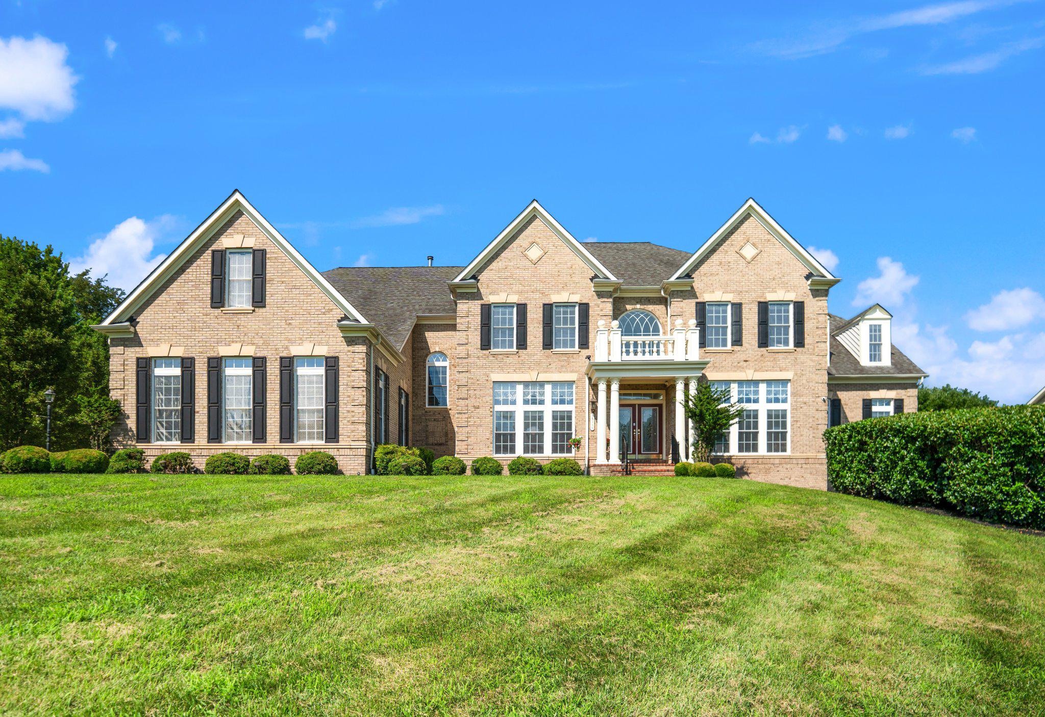 Nestled in a highly desired school district on just under one acre of peaceful nature, this magnificent estate offers over 9,200 square feet of living area with an unparalleled blend of grand luxury and quiet privacy. A spectacular grand entrance opens to high ceilings with elegant crown molding, pristine marble tiles, rich cherry hardwood floors, and bright natural light throughout. The home will easily accommodate large families with its seven (7) bedrooms (all with walk-in closets) and five (5) full bathrooms with one (1) half bathroom.  Designed for unforgettable entertaining, the home also boasts a premium home theater and a custom basement bar in the fully finished walk-out basement, which flows effortlessly to an expansive lower patio and a large deck overlooking the serene backyard. Absolute convenience and peace of mind are guaranteed with a 3-car garage, abundant driveway parking, newer HVAC systems (2023), and a natural gas backup generator. Schedule your showing today!