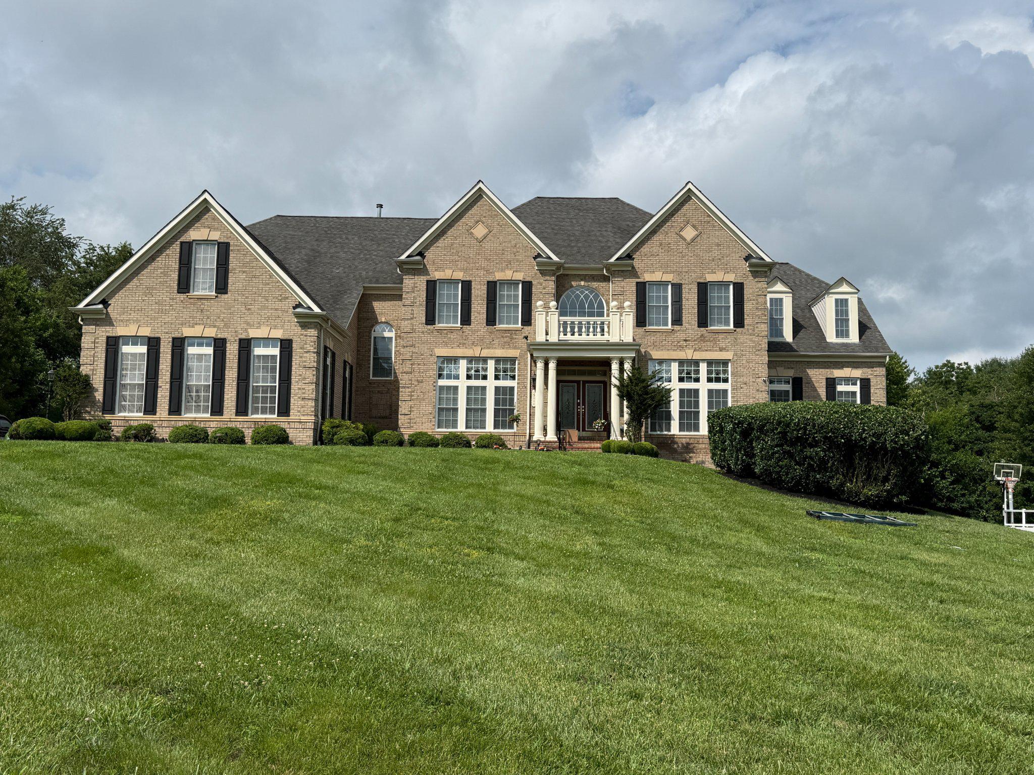 Nestled in a highly desired school district on just under one acre of peaceful nature, this magnificent estate offers over 9,200 square feet of living area with an unparalleled blend of grand luxury and quiet privacy. A spectacular grand entrance opens to high ceilings with elegant crown molding, pristine marble tiles, rich cherry hardwood floors, and bright natural light throughout. The home will easily accommodate large families with its seven (7) bedrooms (all with walk-in closets) and five (5) full bathrooms with one (1) half bathroom.  Designed for unforgettable entertaining, the home also boasts a premium home theater and a custom basement bar in the fully finished walk-out basement, which flows effortlessly to an expansive lower patio and a large deck overlooking the serene backyard. Absolute convenience and peace of mind are guaranteed with a 3-car garage, abundant driveway parking, three newer HVAC systems (2023), and a full natural gas backup generator. Schedule your showing today!