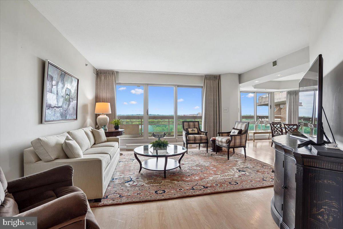 Sensational north & west facing views from this bright and open 1,593 sq ft luxury condo with 2 bedrooms/2 baths & huge 59' wraparound balcony.  Travertine marble entry foyer, ceramic-tiled kitchen & baths, and hardwood flooring throughout the living/dining/bedrooms.  A separate laundry room is adjacent to the table-space kitchen.  Open living room w/sliders to the balcony and a formal dining room w/bay window.  The primary bedroom suite has a dressing area, a large walk-in closet, a sitting room area in the bedroom chamber, and sliders to the balcony.  The primary bath has a jetted soaking tub and a separate shower.  he 2nd bedroom has a double closet, custom built-in shelving & desk, sliders to the balcony, and an ensuite full bath.  Two garage parking spaces (G1-41 & 42) and a storage unit (management to allocate to new owner) convey.  Enjoy the Somerset House community amenities: 24-hour security & gatehouse, valet, concierge, tennis courts & pickleball, clubhouse (with indoor/outdoor pools & lifeguards, state-of-the-art gym & aerobics room, racquetball court, billiards & ping pong rooms (plus a large party room), and beautifully landscaped gardens within the grounds of the 17+ acre property.