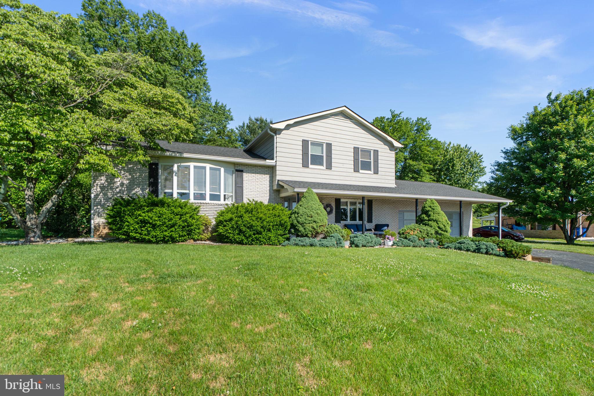 Welcome to this beautifully maintained 3-bedroom, 2 bath home offering over 2,600 square feet of living space on a picturesque .46-acre lot. Combining spacious indoor living with exceptional outdoor amenities, this property delivers the perfect balance of comfort, functionality, and privacy.

Inside, you'll find hardwood flooring throughout much of the home, generously sized bedrooms, and a spacious primary suite complete with a private en-suite bath. The updated bathrooms feature custom tile work and tasteful finishes, while the flexible floor plan provides plenty of room for everyday living, entertaining, and working from home.

The finished lower level offers endless possibilities and can serve as a recreation room, media room, guest space, home gym, or additional living area. A large laundry room and abundant storage space add to the home's practicality.

One of the standout features of this property is the incredible outdoor living space. Enjoy morning coffee in the screened porch, host gatherings on the expansive deck, or simply relax while overlooking the beautifully landscaped backyard surrounded by mature trees and established plantings. 

With spacious rooms, updated baths, multiple indoor and outdoor living areas, and a peaceful setting on nearly half an acre, this move-in ready home offers a lifestyle that's increasingly hard to find. Schedule your private showing today and experience everything this exceptional property has to offer.