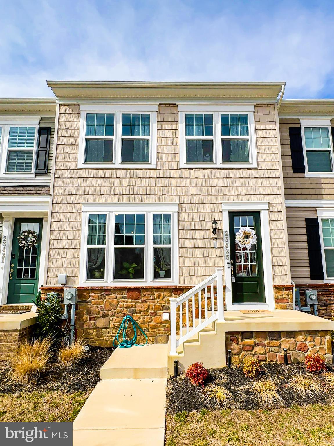 This is the home you've been waiting for.  This gorgeous, almost new home boasts 4 bedrooms and 3.5 bathrooms.   This home is extremely spacious and features mid-level entry, with tons of natural light.  Enjoy an open kitchen floor plan, great for entertaining and open to the living and dining room.   The kitchen features a large island, double wall oven, and quartz counter-tops.  Head outside and enjoy evenings on your large spacious deck with an awning for those sunny days, and looks out to a beautiful tree line with water views.  Upstairs you'll find your primary suite and two additional bedrooms, hallway bath, as well as your laundry room equipped with a beautiful washer/dryer set.  On the lower level is your fourth bedroom, full bath, and an additional entertaining/recreation space.  This area provides ample shopping, restaurants, trails, and beaches nearby.  This is a great opportunity to own this almost new home.