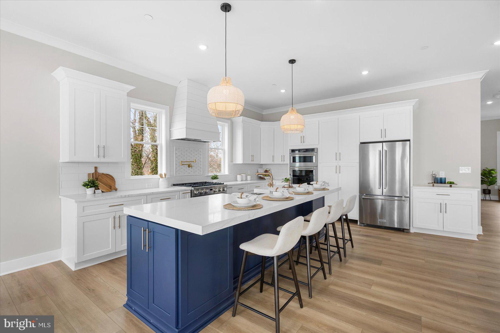 New Price! New Opportunity!
 Completed waterfront new construction on Millers Island with panoramic Chesapeake Bay and Bay Bridge views. This 4-bedroom, 2.5-bath home offers an open, flexible floor plan with 10-foot ceilings, walls of windows, multiple sliding doors, and luxury finishes throughout. The main level offers an office/playroom/5th bedroom bonus space!  The Bayfront primary suite features a private walk-out balcony, tray ceiling, oversized walk-in closet, and spa-inspired bath with waterfront views. The gourmet kitchen is designed for entertaining with a 36-inch gas range, 42-inch cabinetry, double wall oven and microwave, large center island, and hidden walk-in pantry. A main-level office or guest room can serve as the fifth bedroom. Enjoy double-decker decks, sweeping bay views, and a prime location near local dining, waterfront bars, and recreation.