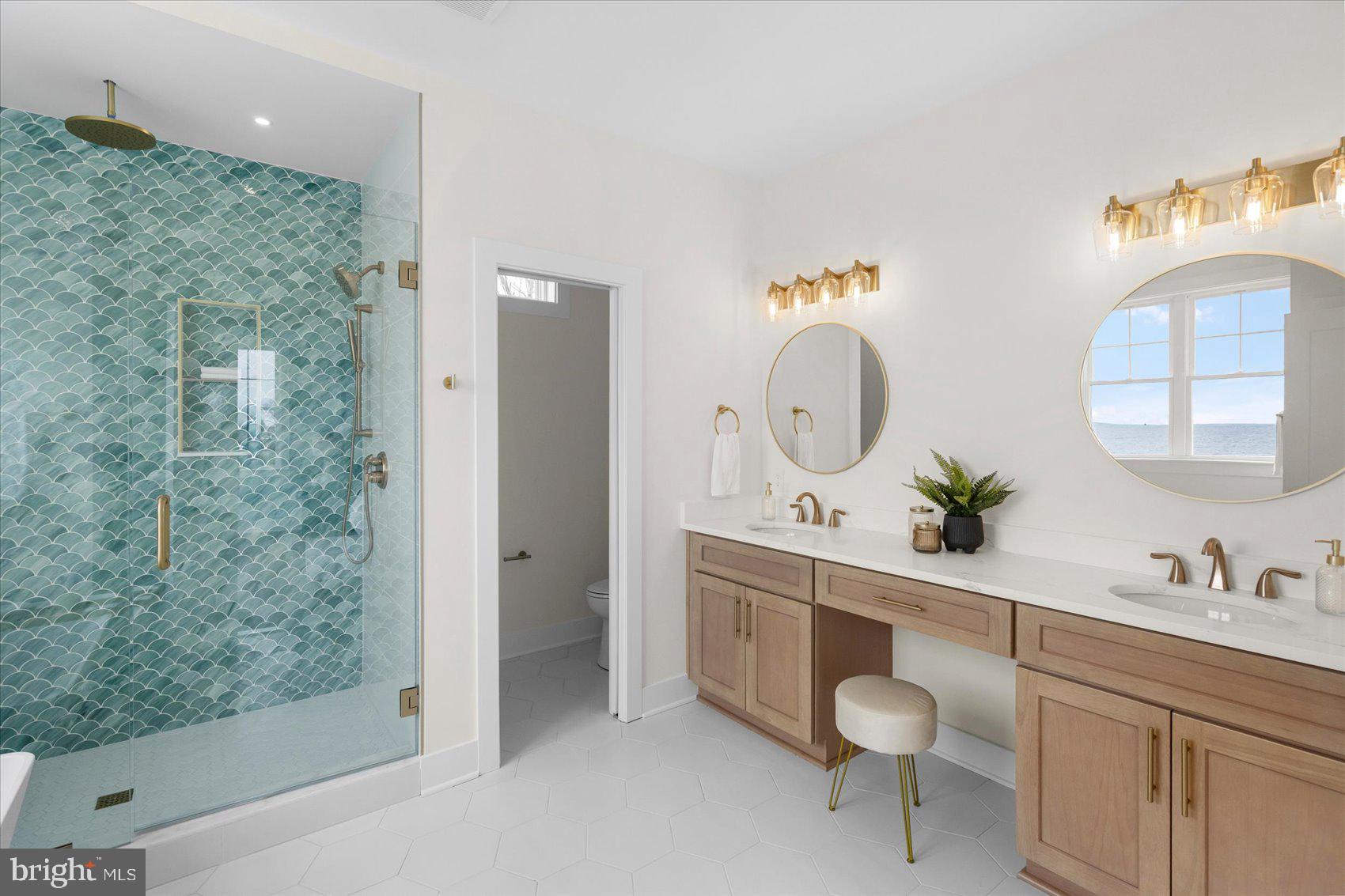 New Price! New Opportunity!
 Completed waterfront new construction on Millers Island with panoramic Chesapeake Bay and Bay Bridge views. This 4-bedroom, 2.5-bath home offers an open, flexible floor plan with 10-foot ceilings, walls of windows, multiple sliding doors, and luxury finishes throughout. The main level offers an office/playroom/5th bedroom bonus space!  The Bayfront primary suite features a private walk-out balcony, tray ceiling, oversized walk-in closet, and spa-inspired bath with waterfront views. The gourmet kitchen is designed for entertaining with a 36-inch gas range, 42-inch cabinetry, double wall oven and microwave, large center island, and hidden walk-in pantry. A main-level office or guest room can serve as the fifth bedroom. Enjoy double-decker decks, sweeping bay views, and a prime location near local dining, waterfront bars, and recreation.