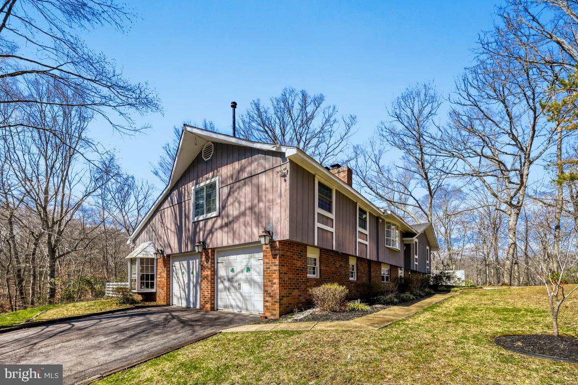 Peace, serenity, and space—just minutes from downtown Annapolis! This beautifully maintained home offers over 3,200 square feet of living space featuring 5 bedrooms, 3 full bathrooms, and three expansive living areas, providing plenty of room to relax, entertain, or work from home.

The spacious, sun-filled kitchen flows effortlessly to a large deck overlooking the fenced backyard, creating the perfect setting for outdoor dining, gatherings, or simply enjoying the peaceful surroundings.

Major updates between 2016–2018 include HVAC, roof, most windows, well pump, and electrical panel, offering peace of mind for years to come.

Perfectly positioned on over 2 private acres, this property is surrounded by county-owned reserve land, giving you exceptional privacy and natural beauty. Located in the highly sought-after Crofton Woods Elementary School district, this home combines space, location, and lifestyle in one rare opportunity. Outdoor exterior paint will be completed before settling as well as other exterior repairs.