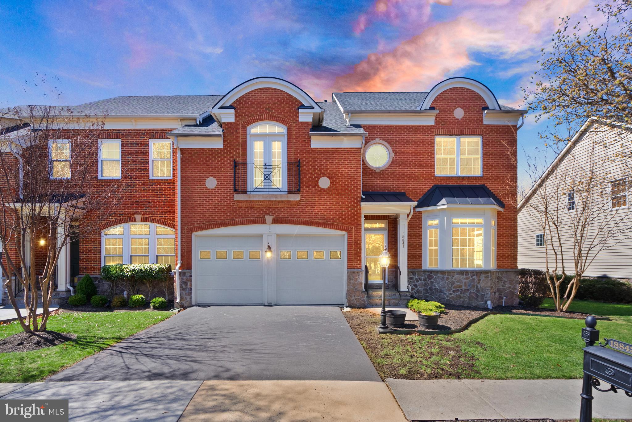 This coveted end-unit townhome in Lansdowne on the Potomac offers the space and privacy of a single-family home paired with all the convenience of luxury townhome living. Backing to mature tree privacy, the property combines expansive interiors with tranquil outdoor spaces, all within a sought-after community known for its top-rated schools and resort-style amenities. Arrive on picturesque Lansdowne streets to a covered entryway and a two-stall garage. Inside, the modern open floor plan blends seamlessly with traditional touches like crown molding and bay windows. Hardwood floors flow through the main level, with formal living and dining areas, a family room open to the kitchen, and two cozy fireplace for gathering. You’ll love the the gourmet kitchen with high-quality cherry cabinetry, a breakfast bar island, and an adjacent eat-in area that opens to a private deck overlooking the wooded common grounds. Upstairs, the primary suite provides a peaceful retreat with its private sitting area and spa-like bath. Three additional bedrooms and two full baths on this level ensure comfort and privacy for family or guests. The lower level further expands your options with a spacious recreation room, a fifth bedroom option, a full bath, and a versatile office or flex space perfect for a gym, craft or play room. Enjoy peace of mind with recent updates including a new roof, HVAC systems, and water heater. Outside the home, enjoy Lansdowne’s extensive amenities: indoor/outdoor pools, fitness facilities, sport courts, trails along Goose Creek and the Potomac River, and proximity to shopping, dining, and historic Leesburg. This home unlocks an exceptional lifestyle in one of northern Virginia’s most celebrated communities.