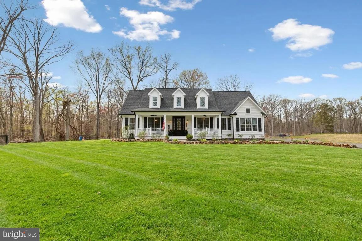Don’t miss this amazing opportunity to enjoy main level living at its finest on over 6 acres zoned agricultural with no HOA in Haymarket. This country style rambler with a beautiful front porch and a fully finished walk up basement has it all. Built in 2018 the home shows like new with plenty of light shining through large skylights. Main level features an open floor plan with plenty of living space, gourmet kitchen with large island,  3 bedrooms, 2 full updated baths, and access to a loft perfect for an office. Walk out from kitchen to deck and fire pit perfect for entertaining. Extra-large primary suite with 2 walk-in closets and beautiful private bath. Wood stoves on main and lower level to keep you cozy all winter. Fully finished walk up lower-level features large family room, legal bedroom, full bath, 2 bonus rooms and plenty of storage. FIOS internet. Septic pumped 6 months ago, new dishwasher, and brand-new HVAC. Fresh paint throughout. Perfect for business owners who want to add storage buildings or keep trucks and equipment on property. Come fall in love.