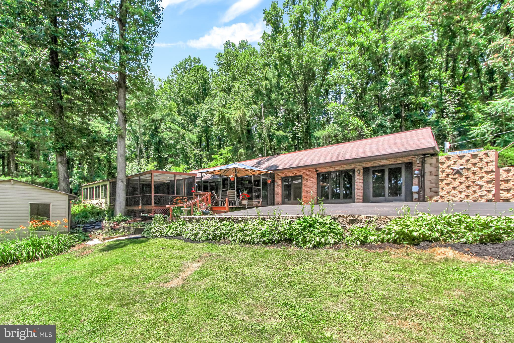 Grab your racquet and your swimsuit ! This unique Earth Sheltered Ranch style home situated on 2.264 acres comes complete with a tennis court and indoor  Endless Pool!  Some of the features include: 3-4 Bdrms  2 Baths  LR, DR and Kitchen with all appliances Family room Craft Room and Solarium, Also if you're a car buff, have a boat or need somewhere to keep your RV this home would be ideal! The 2000 sq ft garage with 9 ft doors can hold 5 cars and includes a workshop area! A great feature of this garage is its drive through capability which would make it ideal for someone with a business or work vehicle that would need loaded with materials, otherwise it serves partially as a 3 car tandem garage. Also comes complete with a  12 X 24 deck and coy pond! Located in East York close to  all conveniences, Rt's 30 and 83. Its time to pack your things ... get ready to move!