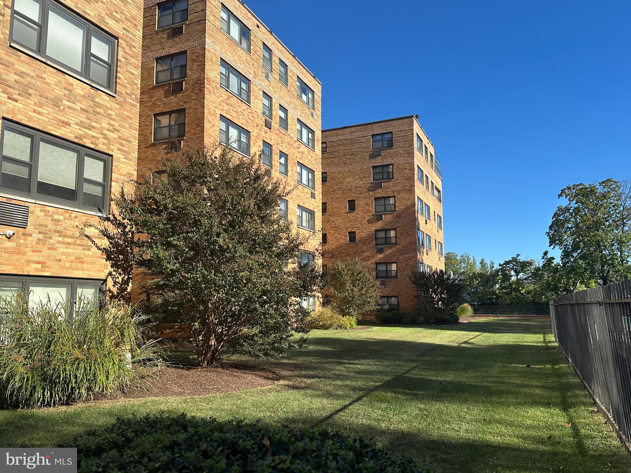 Who wouldn’t love moving into a freshly painted large 2 bed 2 bath condo with gorgeous refinished original solid wood flooring throughout?   There are two doors into the unit. One door accesses the long foyer which has a whole wall of closets and flows into the very bright Southern facing living room. The other door from the hall goes to the updated kitchen with a large refrigerator, gas stove and opens to the dining area. The windows face East so you will have sunshine in the morning as you view the trees at your windows. From the living room, step in the hall which has a double closet, doorways to the primary bedroom, the 2nd bedroom and the hall bath. The washer/dryer are in the hall bath where there is a tub. The primary bedroom with a double closet is at the corner of the building facing East and South and full of light. The adjoining bathroom has a stall shower with new faucets. The 2nd bedroom has big windows overlooking lovely landscaping. The lower level of this building has a designated storage cage, a social room for meetings and get togethers as well as workout room and access to the pool area. This building has newer elevators and boilers for heating. There is brand new upgraded 100 AMP electrical service, outlets are now grounded, new lighting fixtures installed, also. There is an on-site manager and you will love the lush grounds, the pool, workout room and easy parking. This unit is superbly located near transportation, shopping, St Joe’s University, Bala Cynwyd Library, and parks. The move in fee is $500, plus $100 for 4 hours and $750 deposit returnable after move in. The capital contribution is $1336. New Assessment due of $735 on each months of June 2026 and November 2026.  Garage space rental is $80 when available. Electric charge is added to the condo fee of $735/month. Only cats are permitted. This is a lovely and convenient place to live.